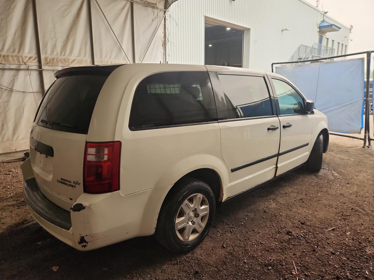 2009 Dodge Grand Caravan C/v White vin: 2D4HN11E79R611119 Damage: Right Rear Wheel Housing, Rust, Naaa Acceptable