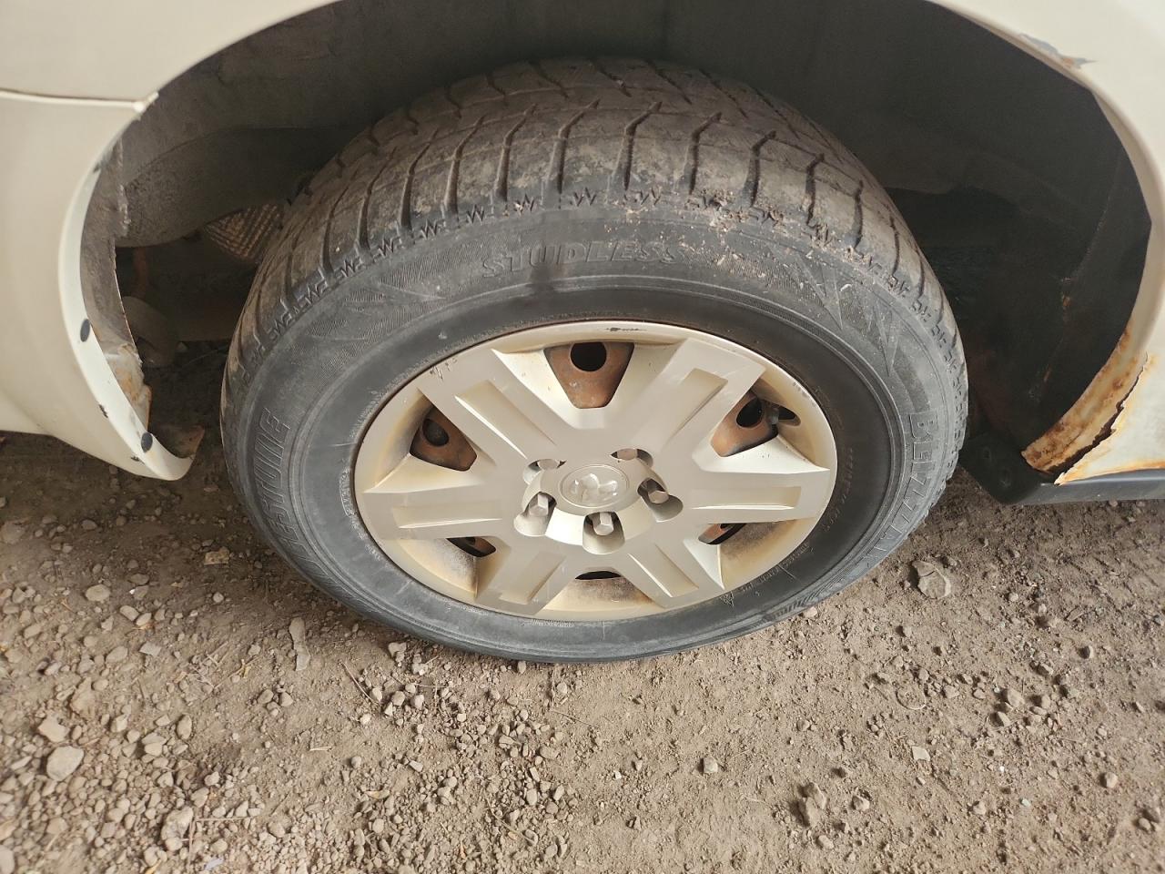 2009 Dodge Grand Caravan C/v White vin: 2D4HN11E79R611119 Damage: Left Rear Wheel Cover, Curb Rash, 2 To 3 Inches