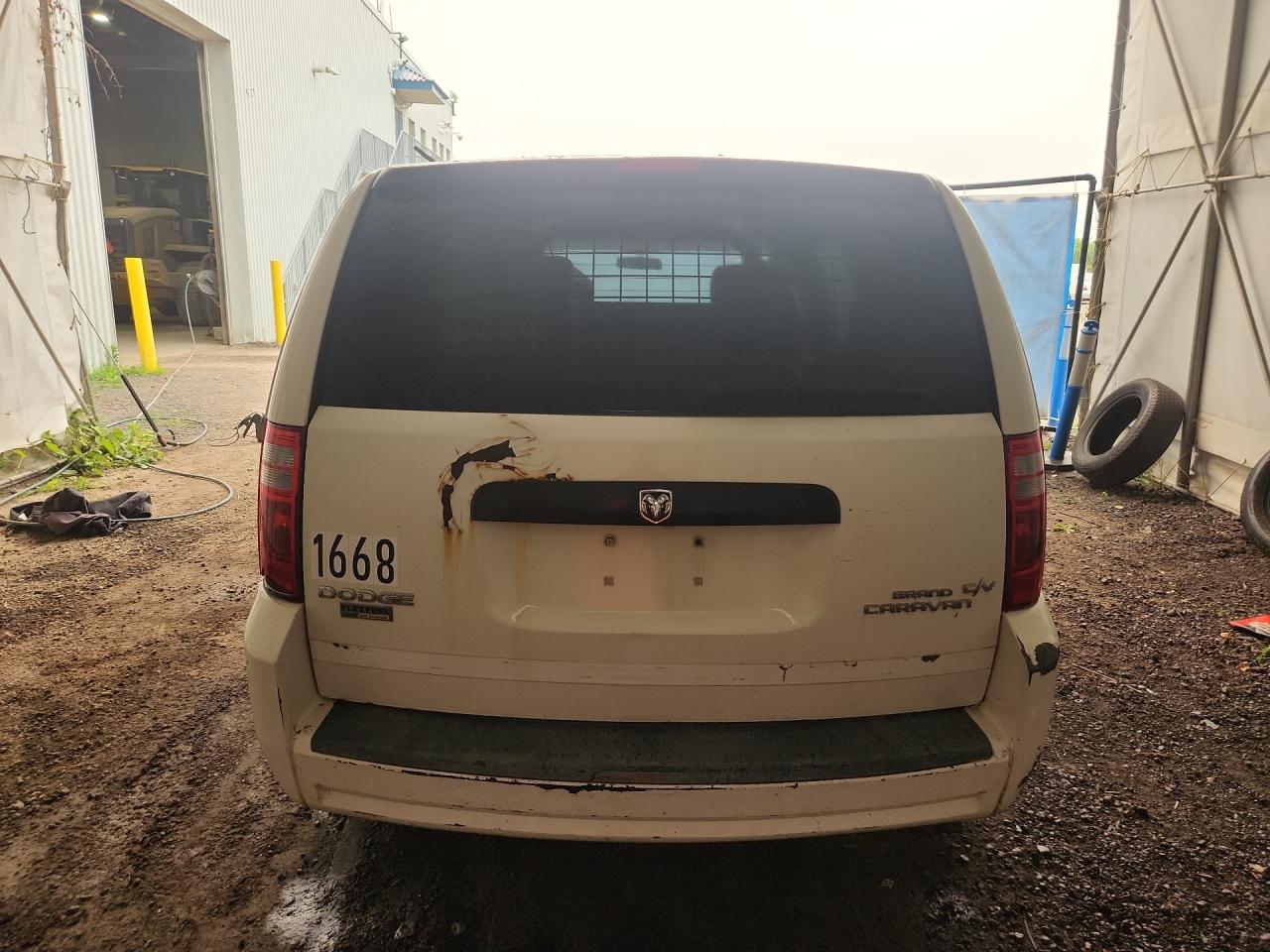 2009 Dodge Grand Caravan C/v White vin: 2D4HN11E79R611119 Damage: Lift Gate, Rust, > 12 Inches
