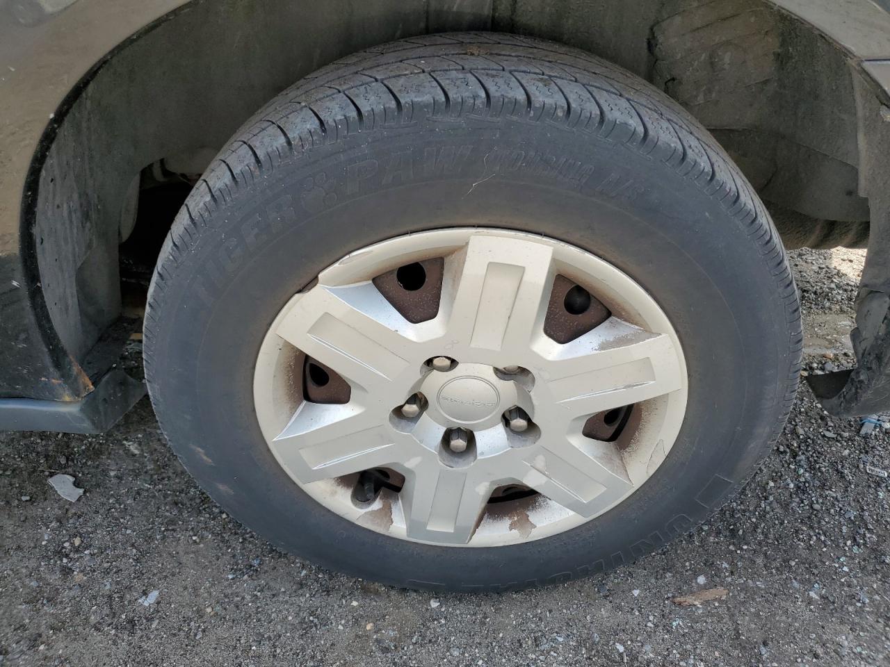 2011 Dodge Grand Caravan C/v Black vin: 2D4RN1AG2BR740087 Damage: Left Rear Wheel Cover, Broken, Replacement Required