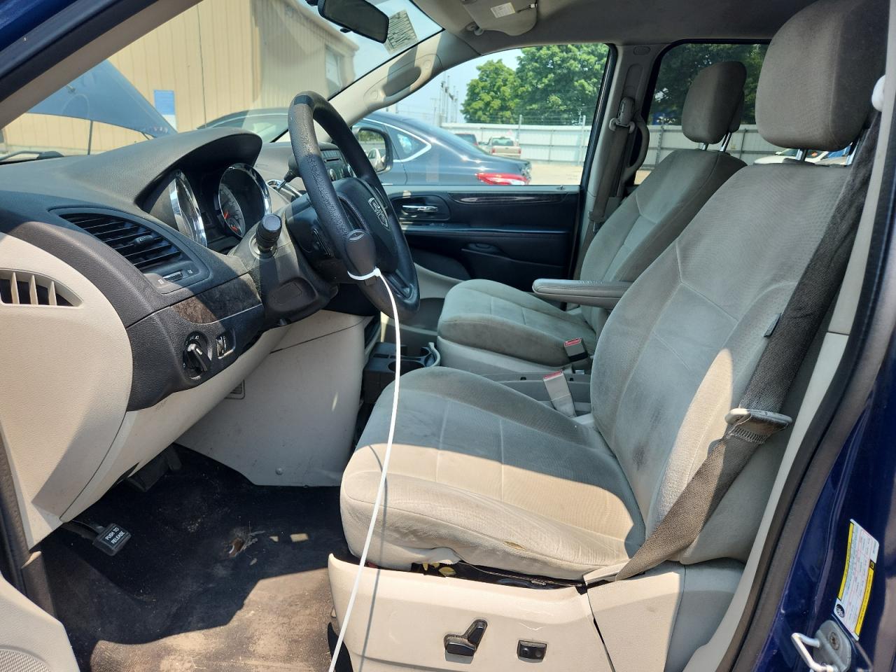 2011 Dodge Grand Caravan Express Blue vin: 2D4RN4DG8BR720553 Damage: Left Front Seat, Torn, 1/2 To 1 Inch