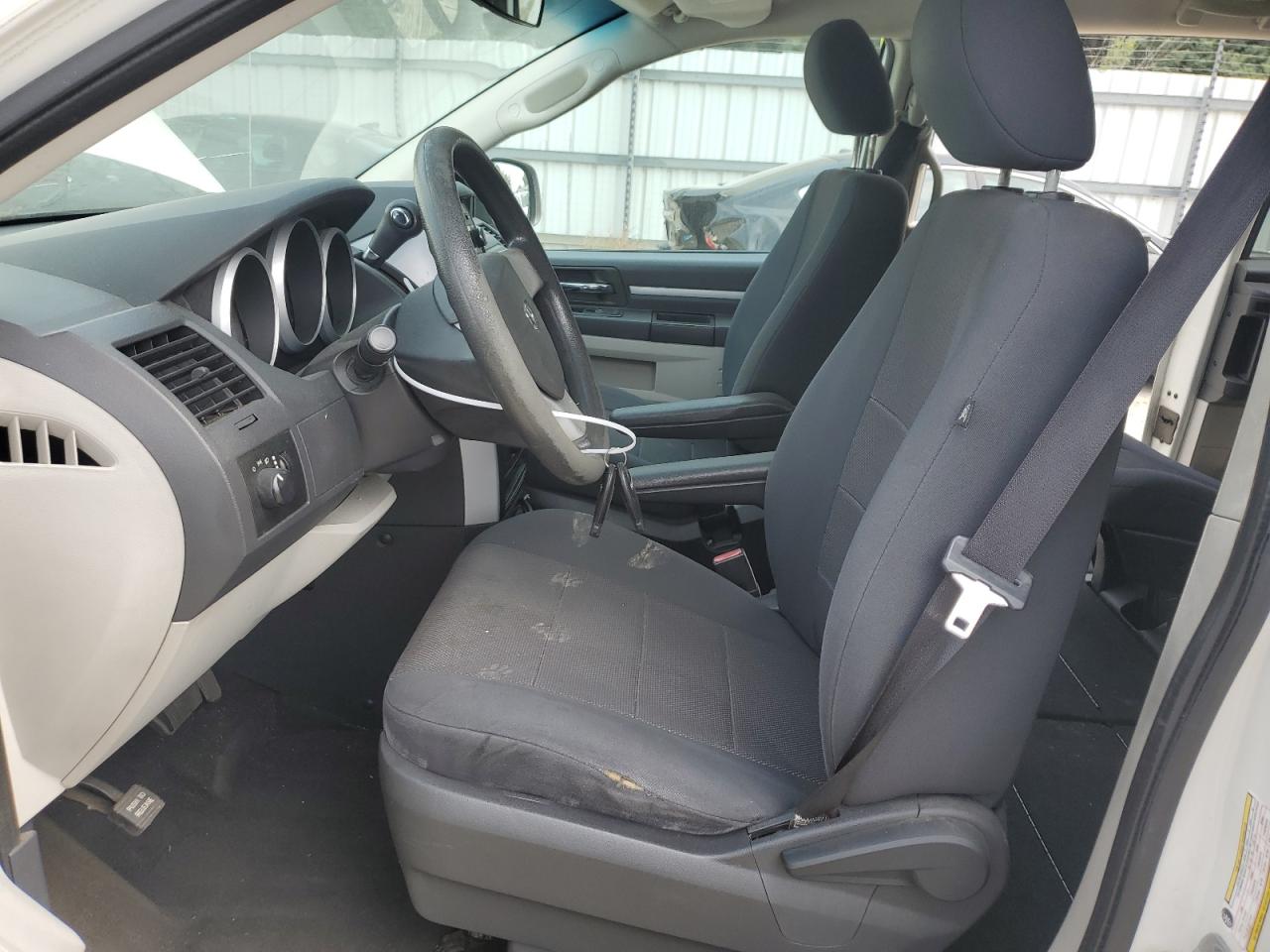 2009 Dodge Grand Caravan Se White vin: 2D8HN44E39R693264 Damage: Left Front Seat Cushion, Worn, Replacement Required