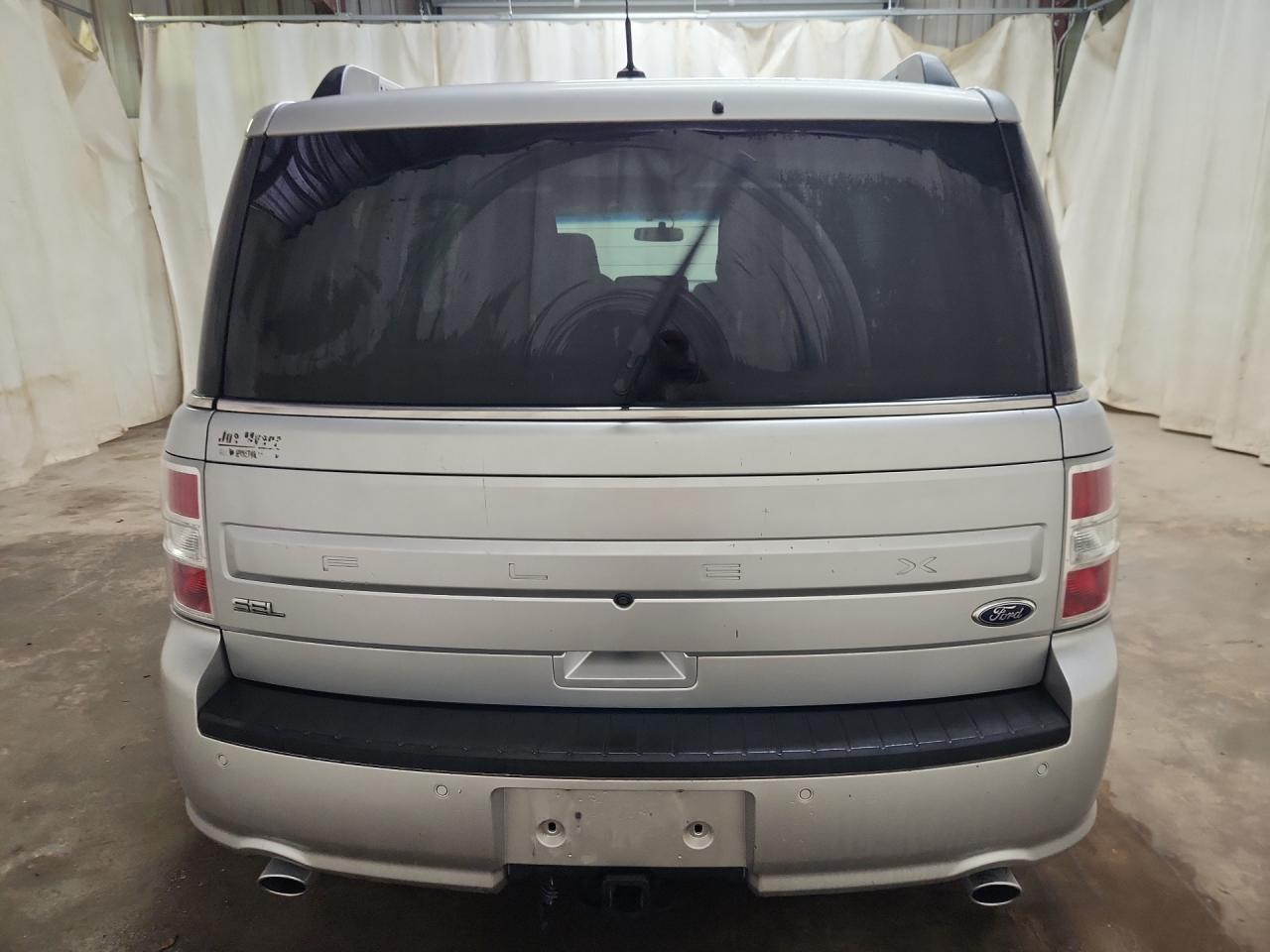2015 Ford Flex Sel Silver vin: 2FMGK5C82FBA18963 Damage: Rear Bumper, Heavy Scratch, 1/2 To 1 Inch