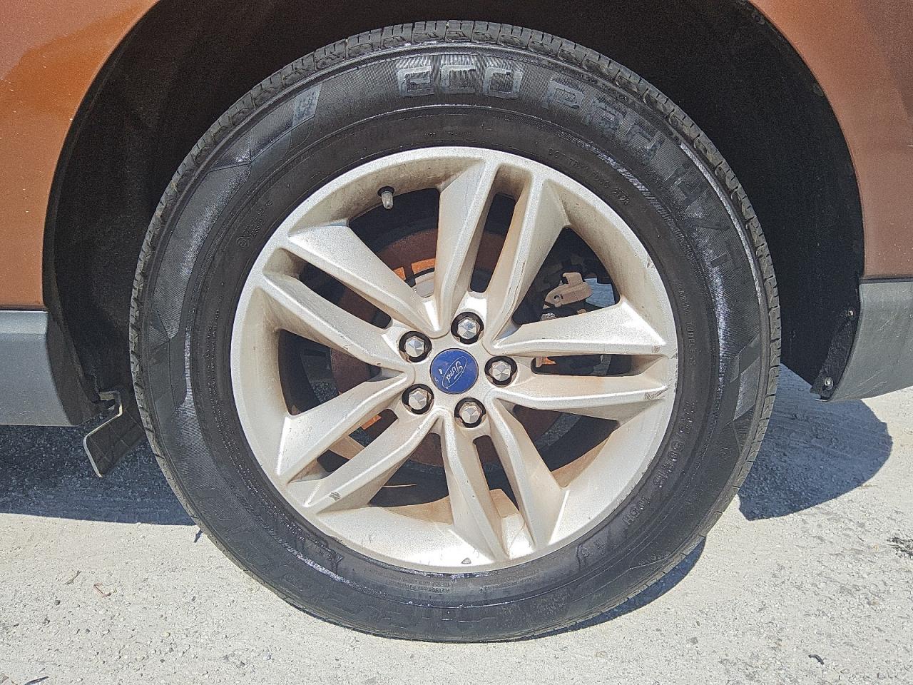 2017 Ford Edge Sel Orange vin: 2FMPK3J95HBC27939 Damage: Left Rear Wheel, Curb Rash, 6 To 7 Inches