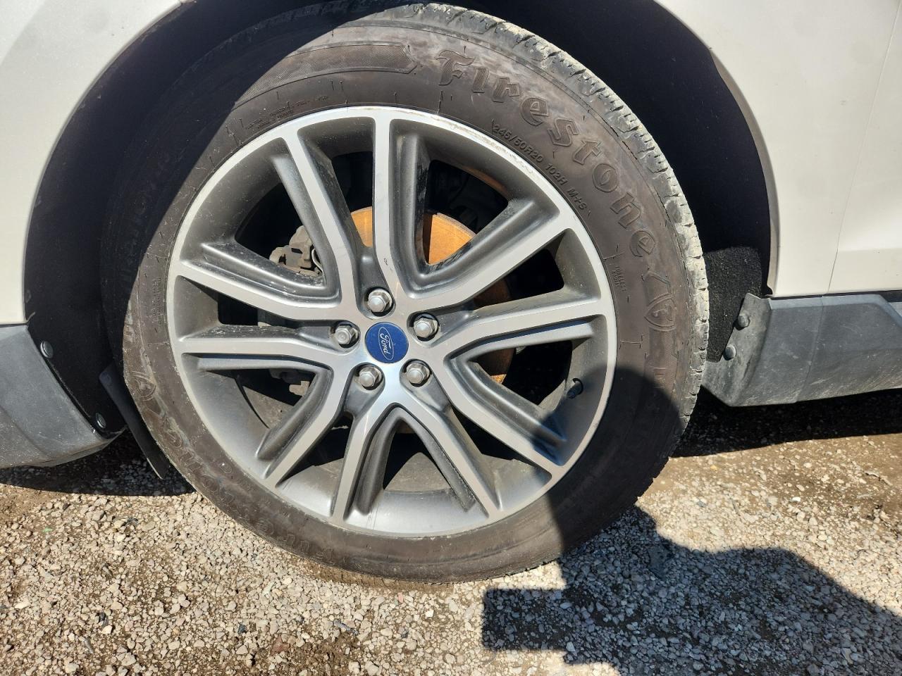 2019 Ford Edge Titanium White vin: 2FMPK3K93KBC68267 Damage: Left Front Tire, Worn, Replacement Required