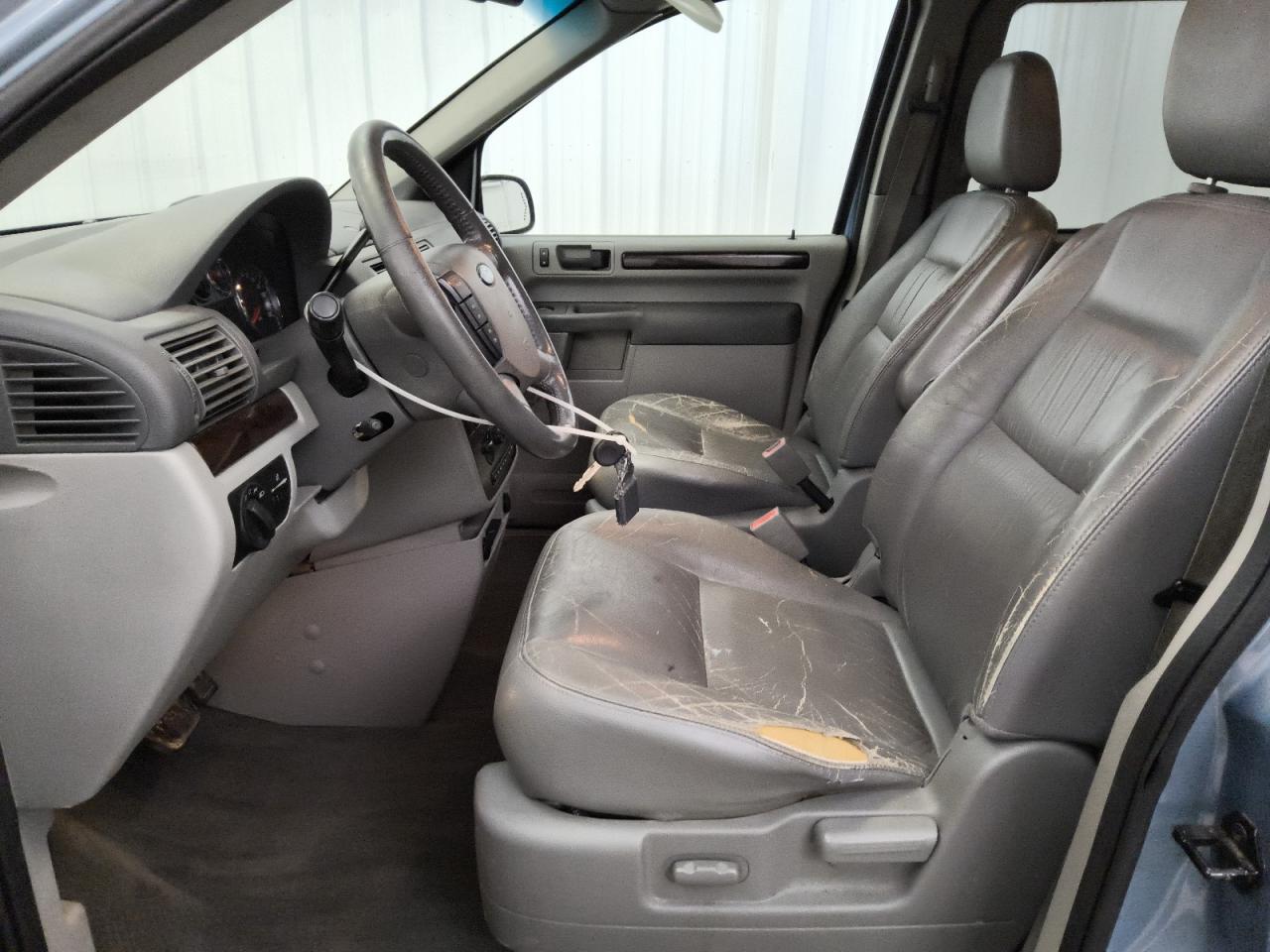 2007 Ford Freestar Sel Blue vin: 2FMZA52267BA04753 Damage: Left Front Seat, Torn, > 12 Inches