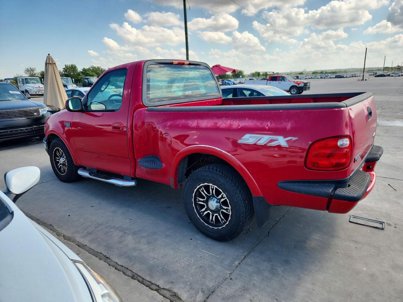 2003 Ford F150 Red vin: 2FTRF07263CA54493