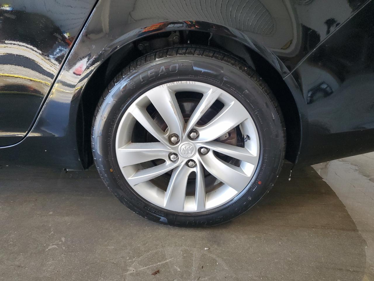 2015 Buick Regal Premium Black vin: 2G4GN5EX8F9134655 Damage: Left Rear Wheel, Curb Rash, 7 To 8 Inches