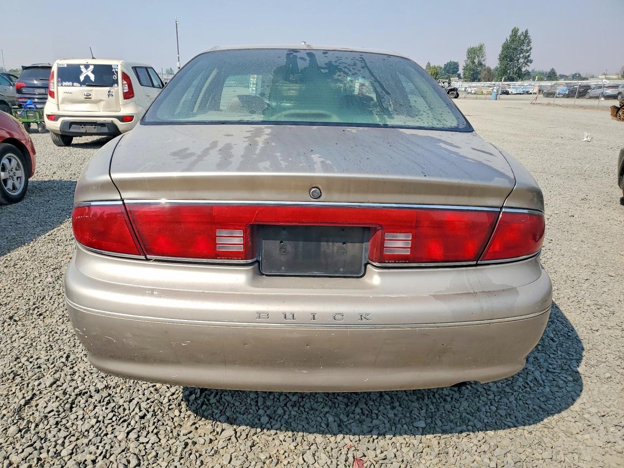 1999 Buick Century Limited Tan vin: 2G4WY52M7X1456216