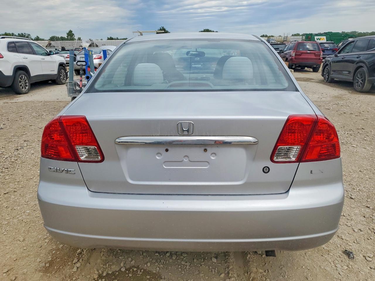 2003 Honda Civic 4d Серебряный vin: 2HGES16503H589545