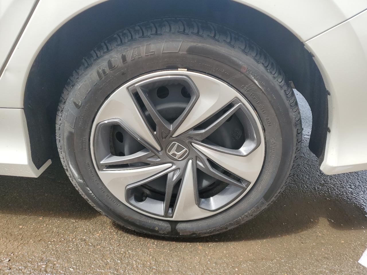 2021 Honda Civic Lx White vin: 2HGFC2F59MH017107 Damage: Left Rear Wheel Cover, Multiple Scratches Light, 4