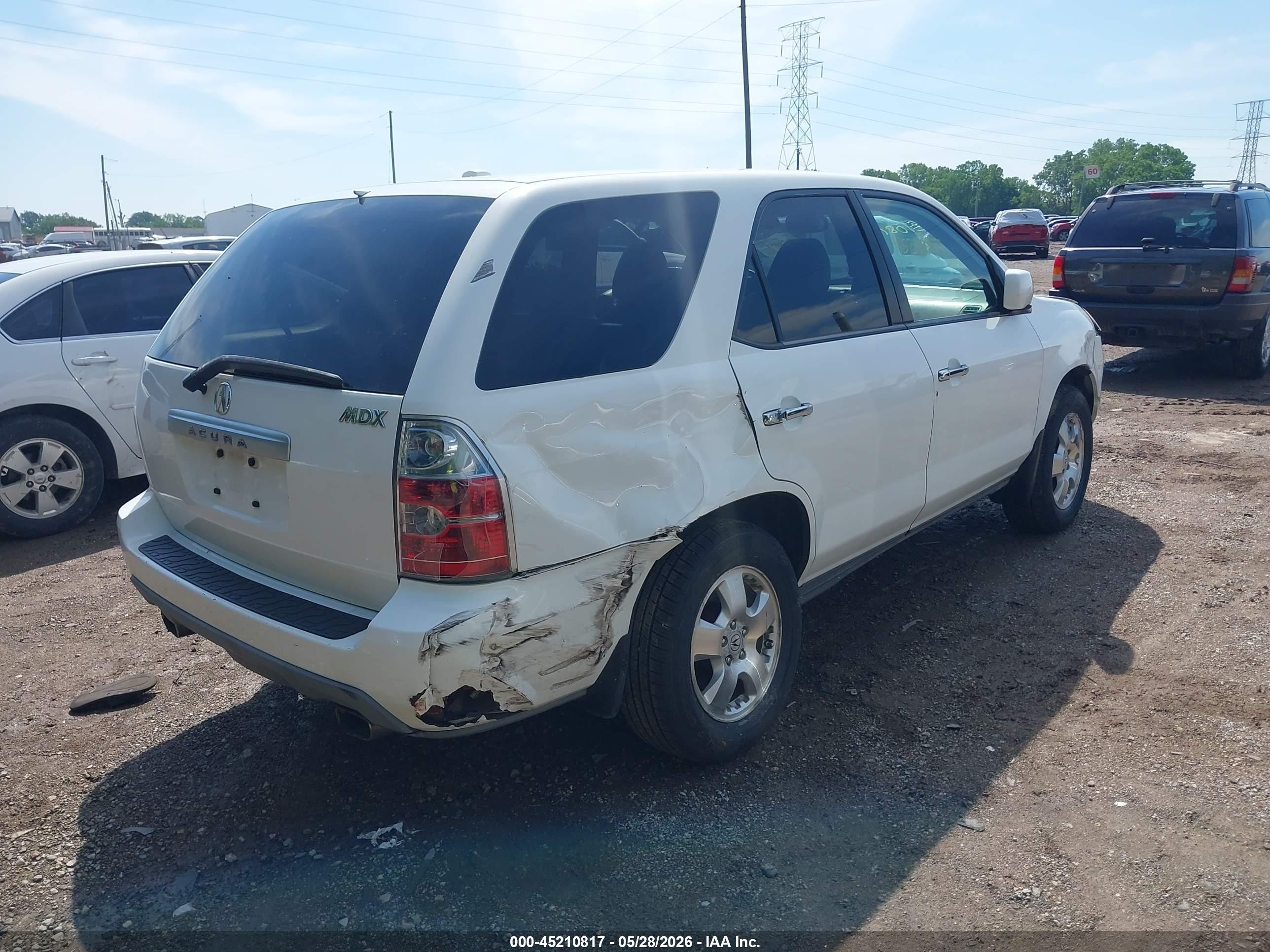 2005 Acura Mdx   White vin: 2HNYD18285H548375