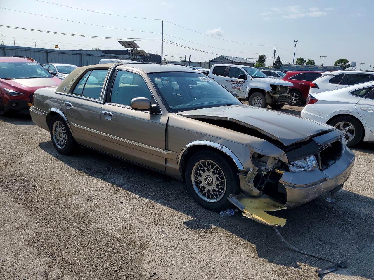 2001 Mercury Grand Marquis Gs Tan vin: 2MEFM74W11X660250