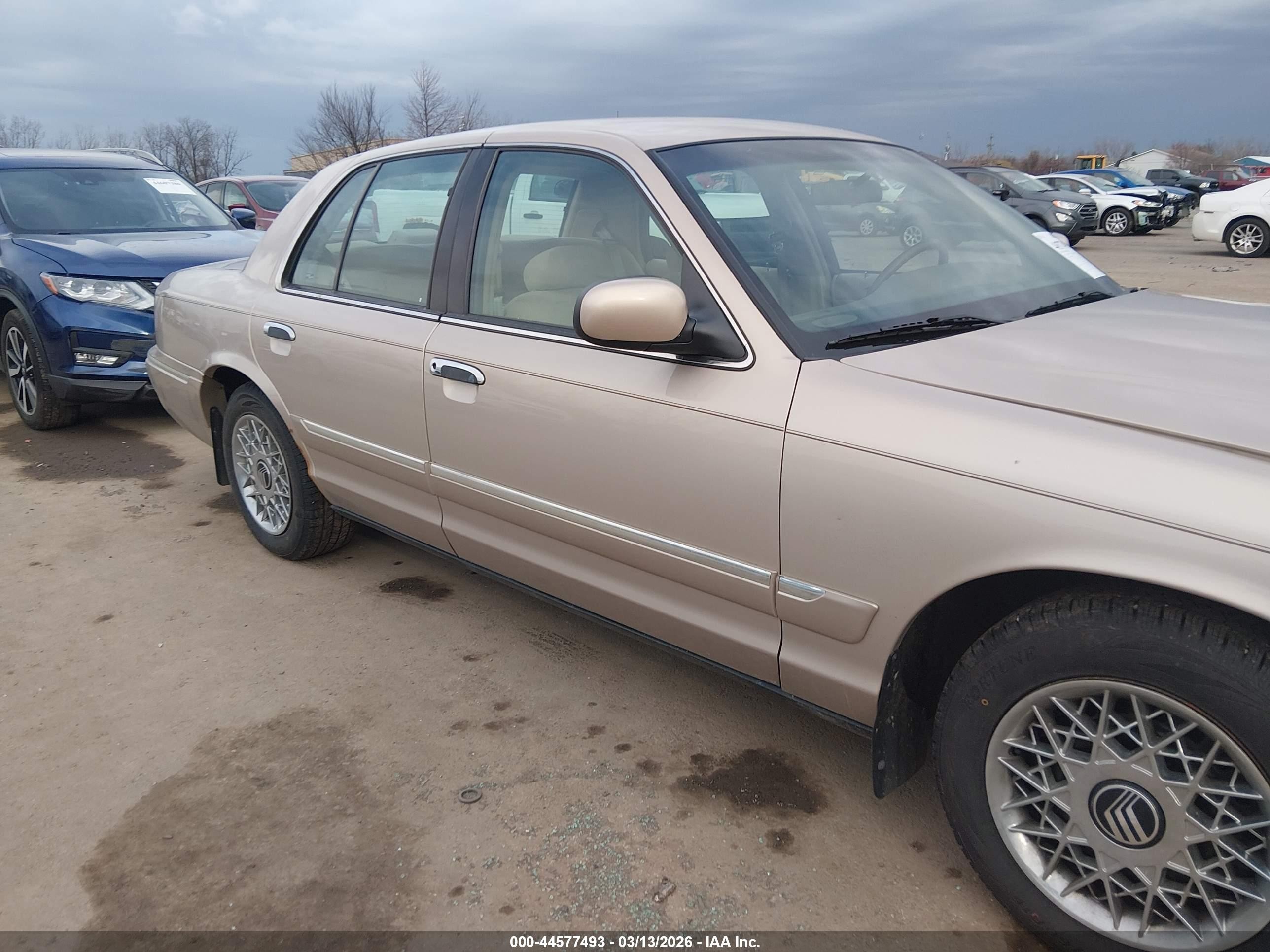 1998 Mercury Grand Marquis   Tan vin: 2MEFM74W1WX618765