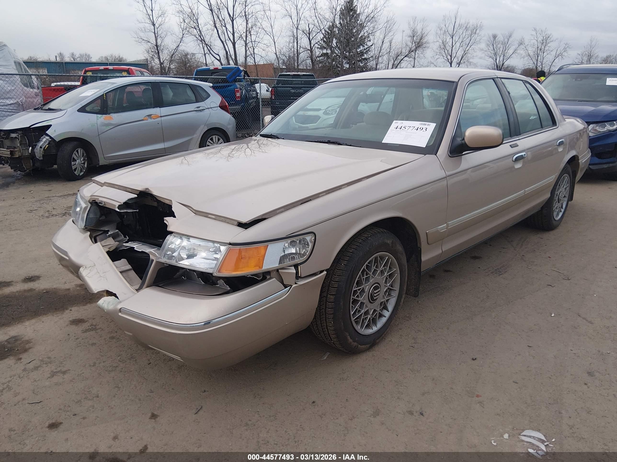 1998 Mercury Grand Marquis   Tan vin: 2MEFM74W1WX618765
