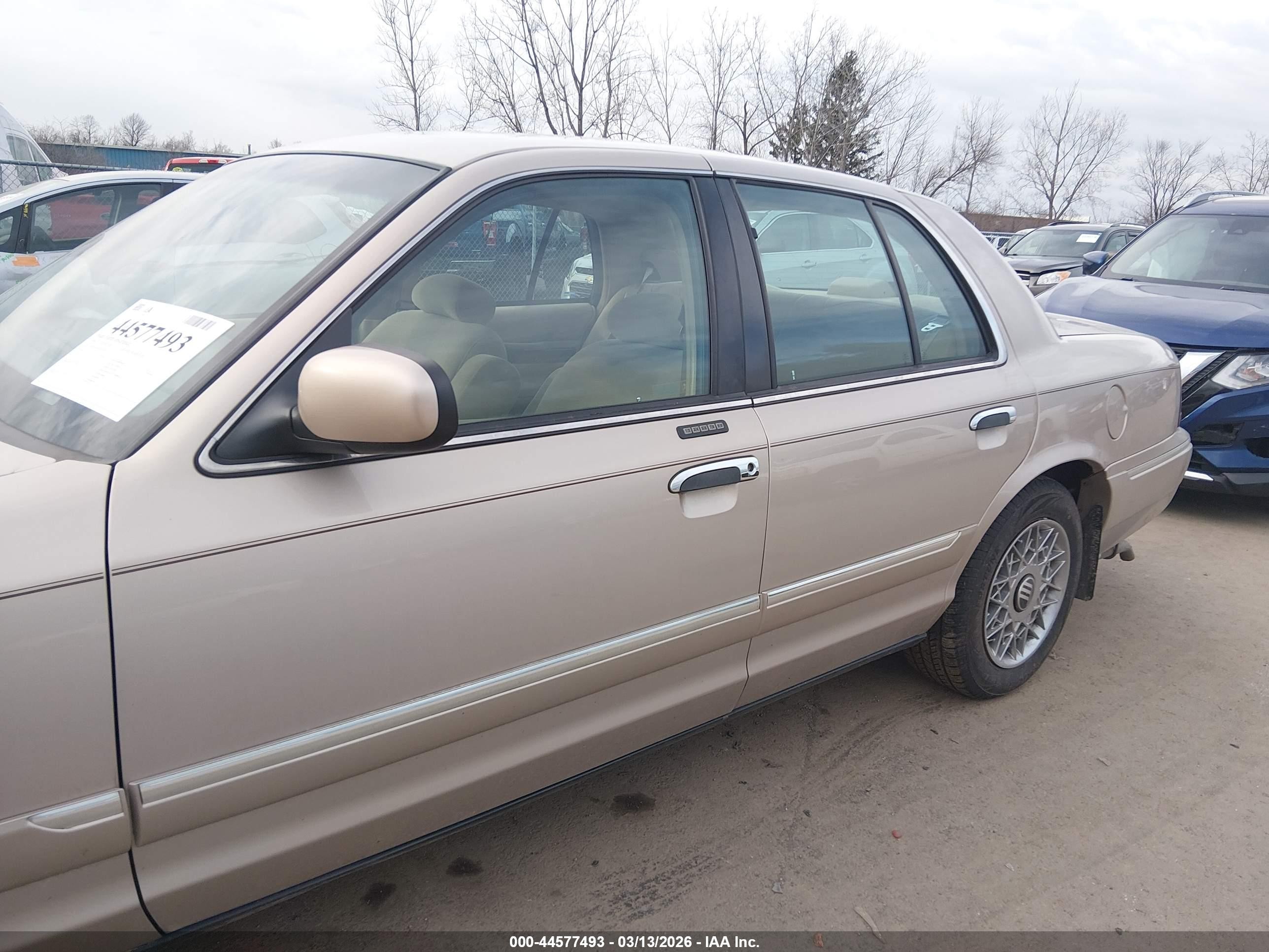 1998 Mercury Grand Marquis   Tan vin: 2MEFM74W1WX618765