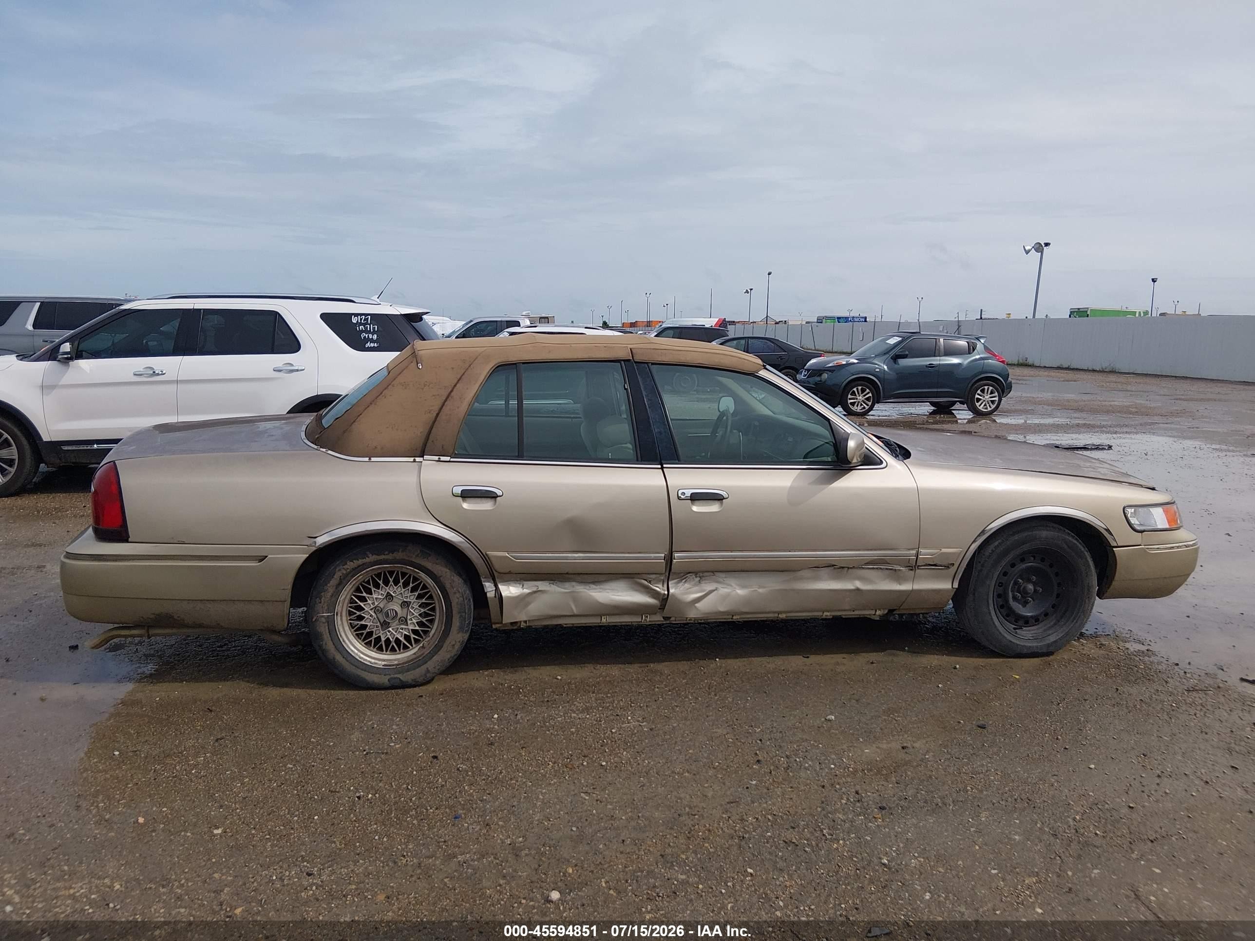1999 Mercury Grand Marquis Gs Champagne vin: 2MEFM74W1XX689577