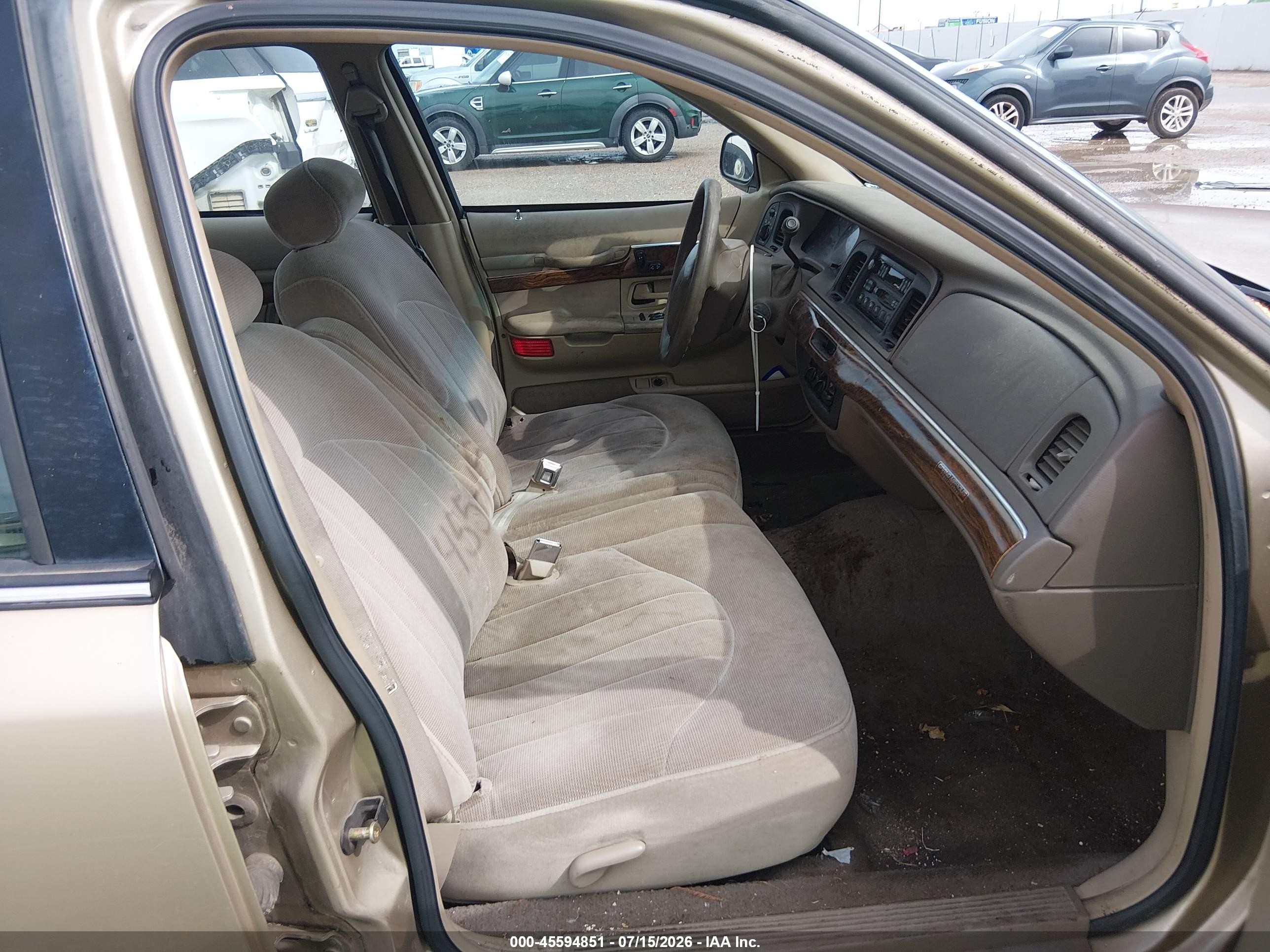 1999 Mercury Grand Marquis Gs Champagne vin: 2MEFM74W1XX689577