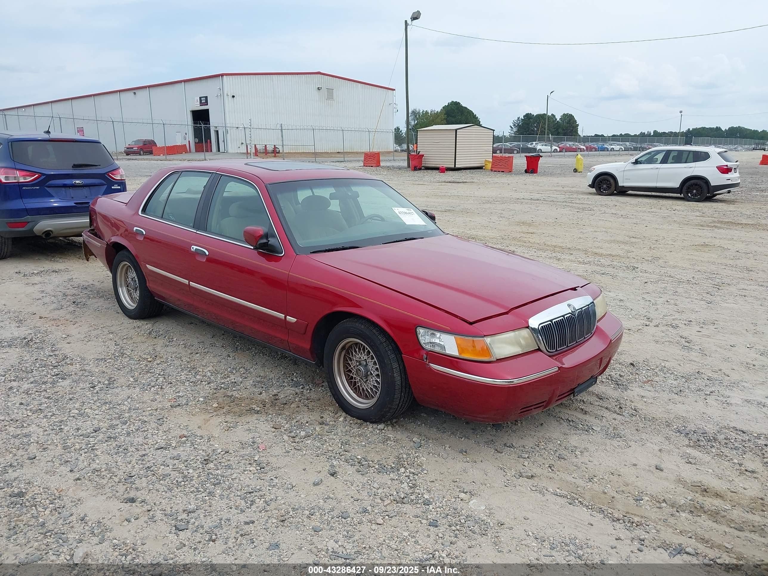 1998 Mercury Grand Marquis   Orange vin: 2MEFM74W5WX606621