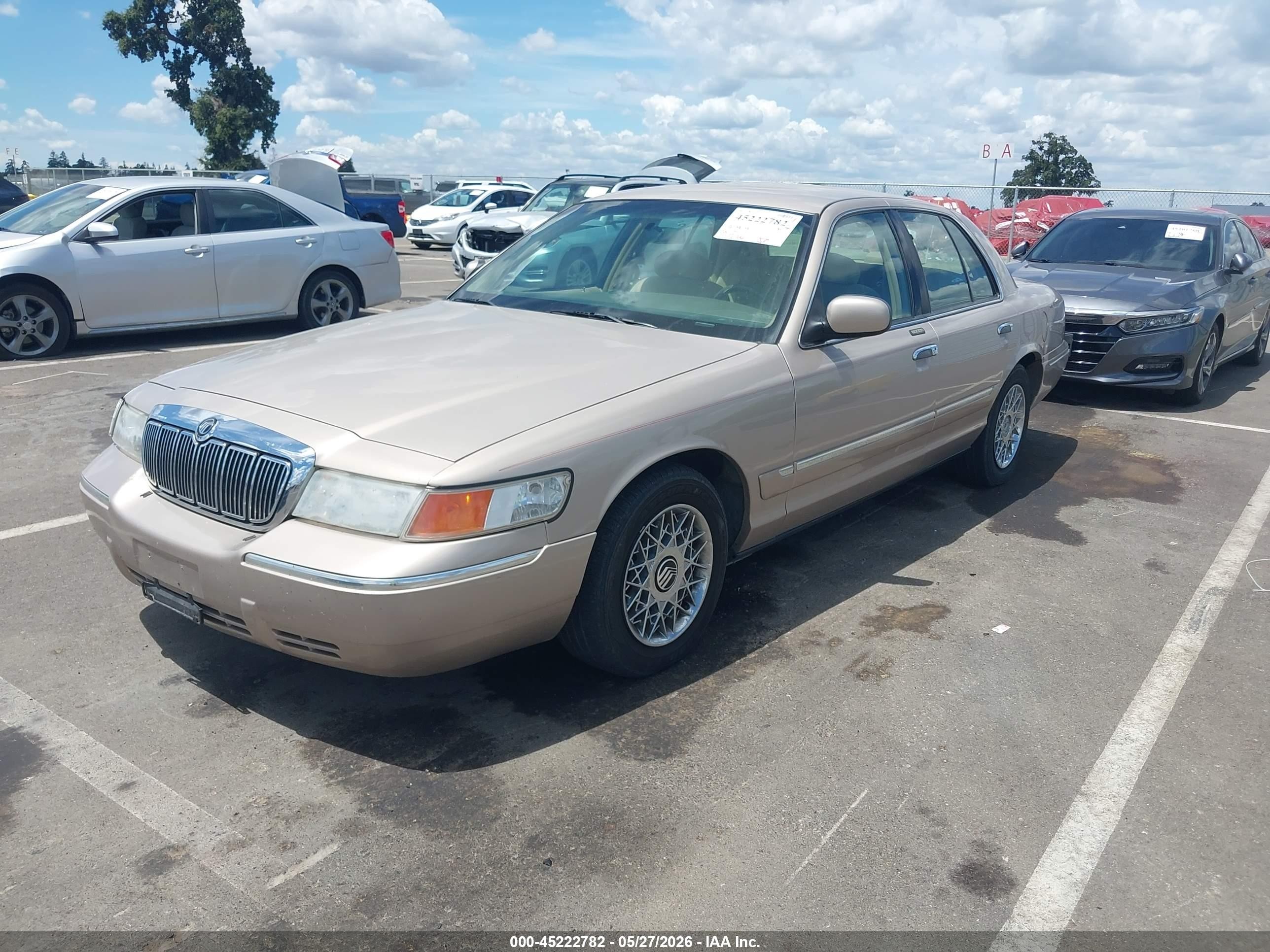 1998 Mercury Grand Marquis   Tan vin: 2MEFM74W5WX646522