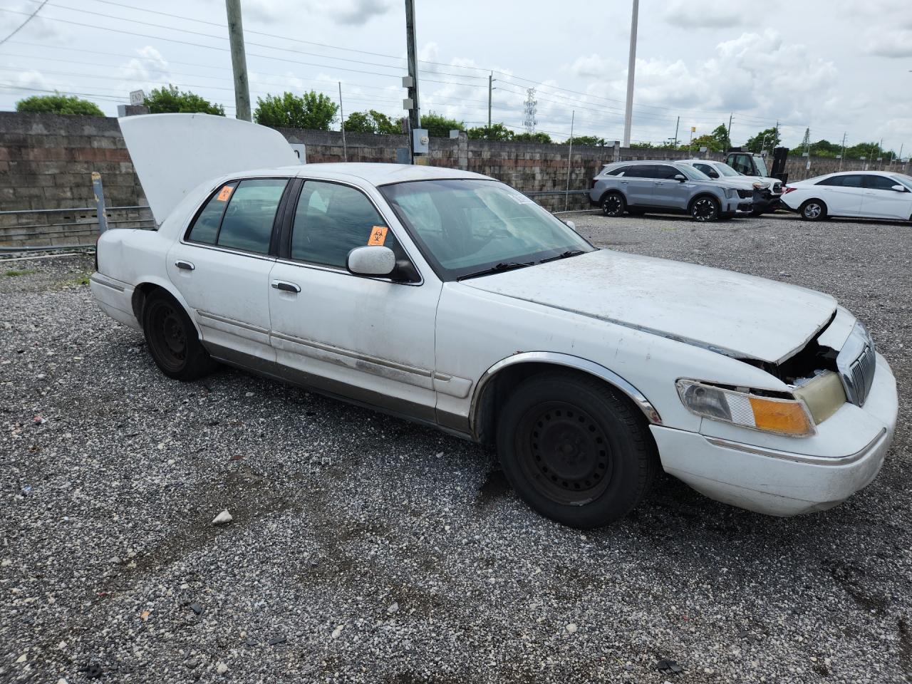 2001 Mercury Grand Marquis Gs White vin: 2MEFM74W61X610329 Damage: Right Front Door, Dent(S) W/ Paint Dmg, 1/8 To 1/2 Inch