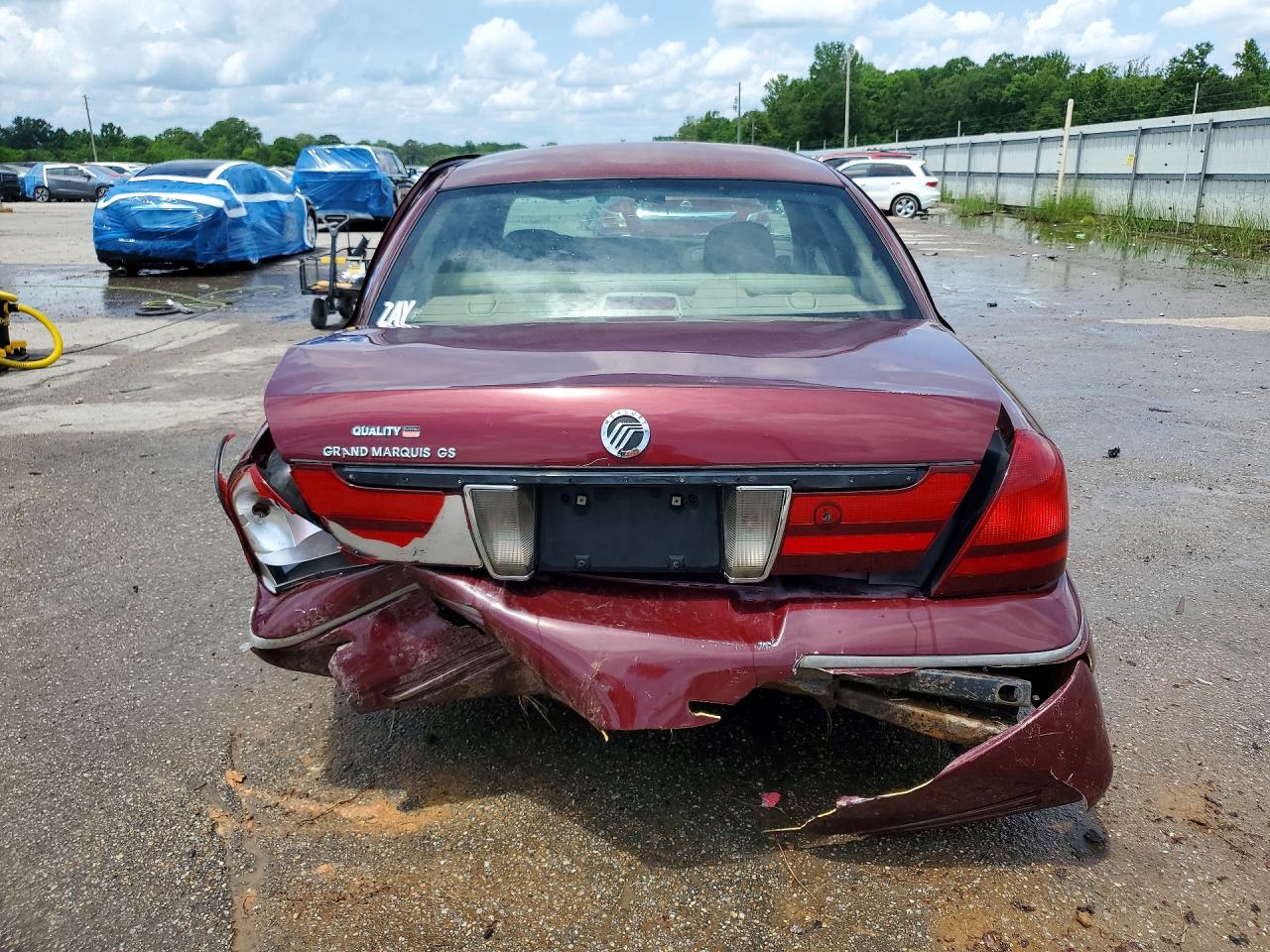 2004 Mercury Grand Marquis Gs Burgundy vin: 2MEFM74W74X604379