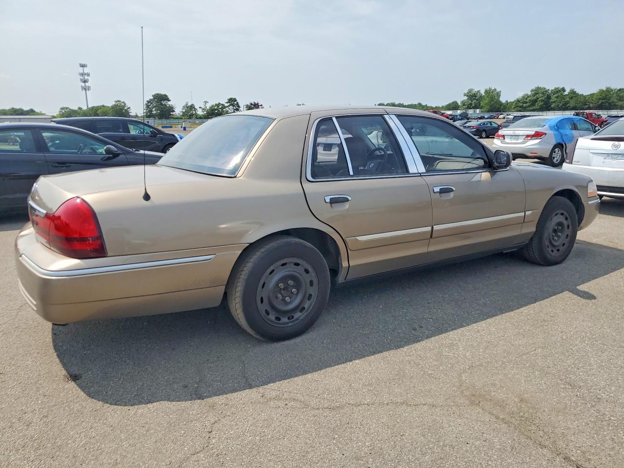 2005 Mercury Grand Marquis Tan vin: 2MEFM74W75X674868