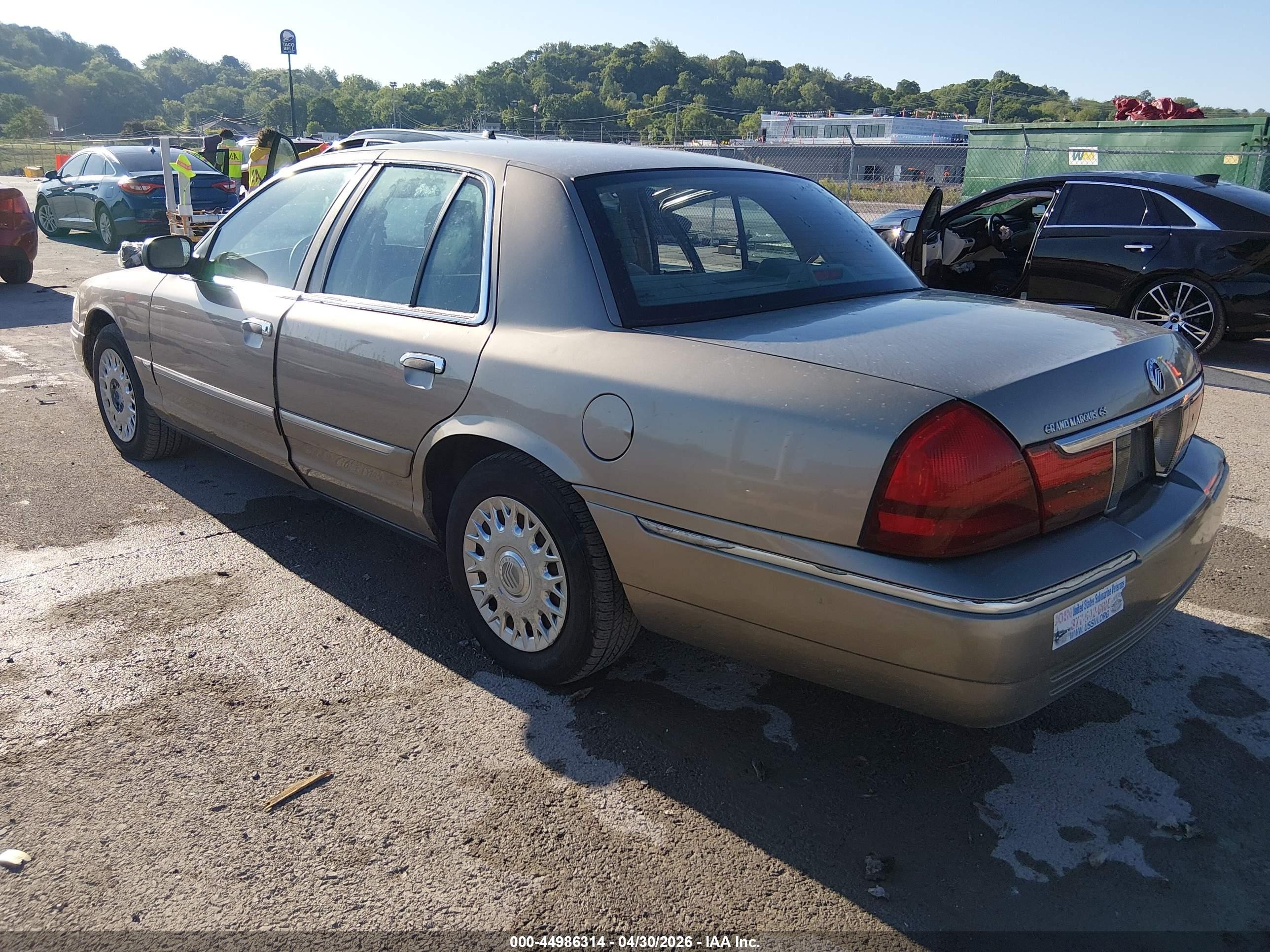 2003 Mercury Grand Marquis Gs Champagne vin: 2MEFM74W93X702649