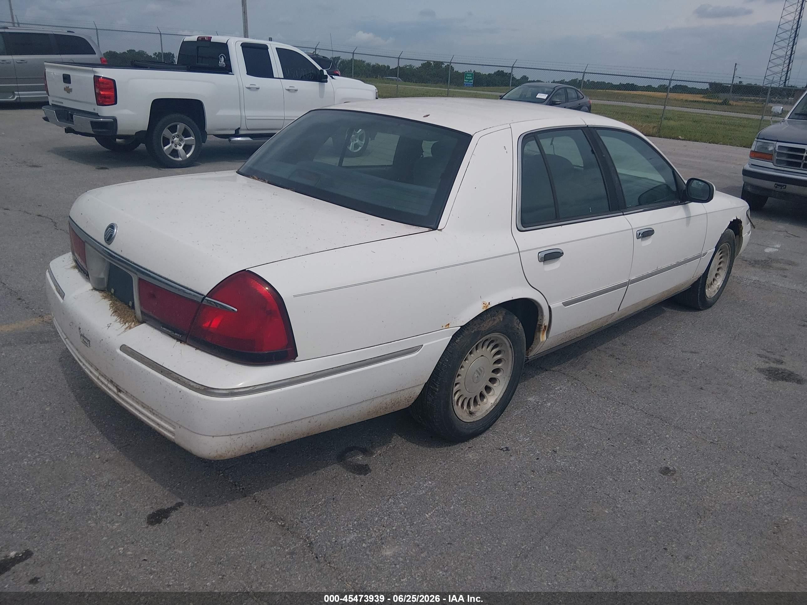 1998 Mercury Grand Marquis   White vin: 2MEFM75W1WX677359
