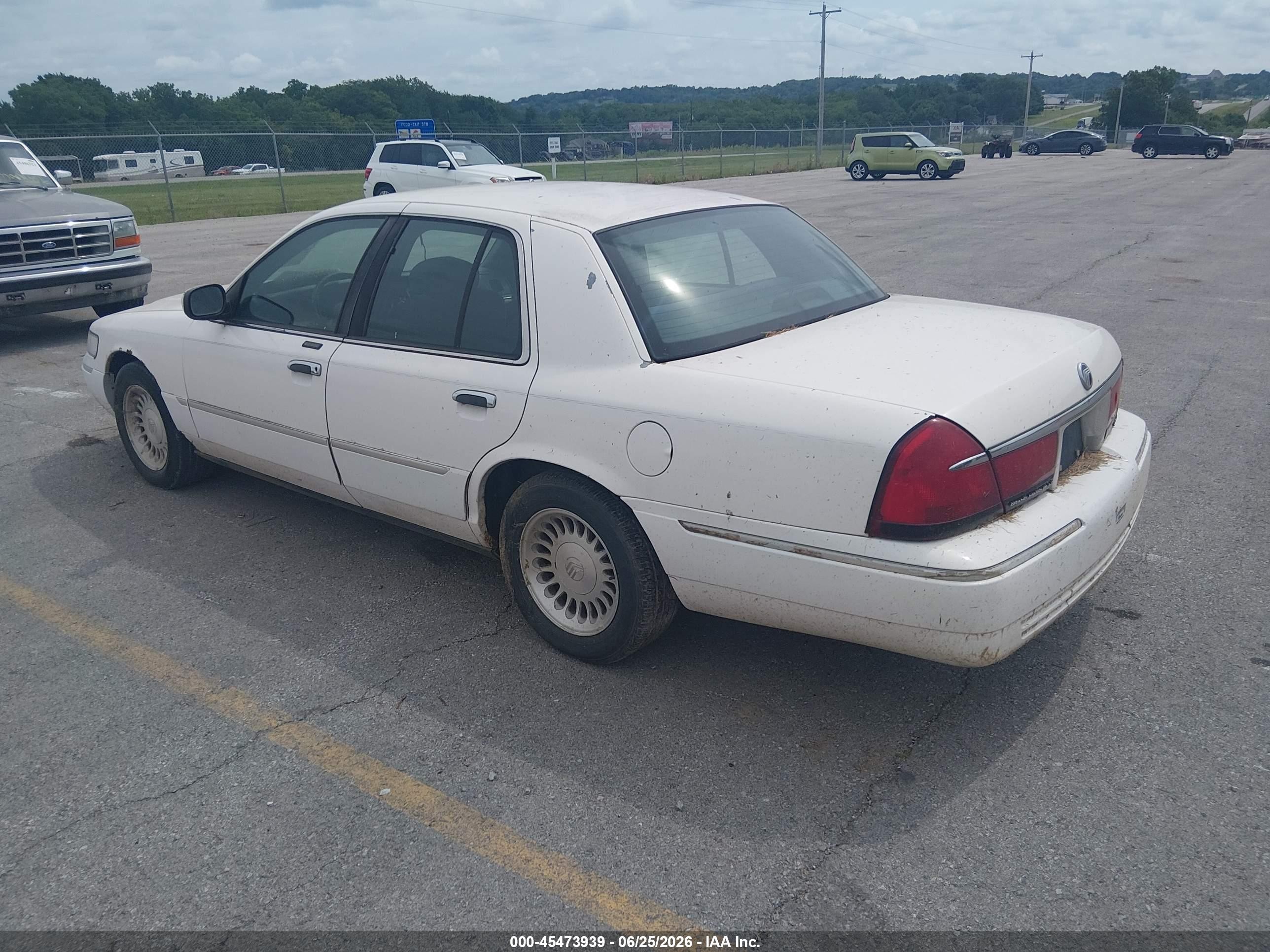 1998 Mercury Grand Marquis   White vin: 2MEFM75W1WX677359