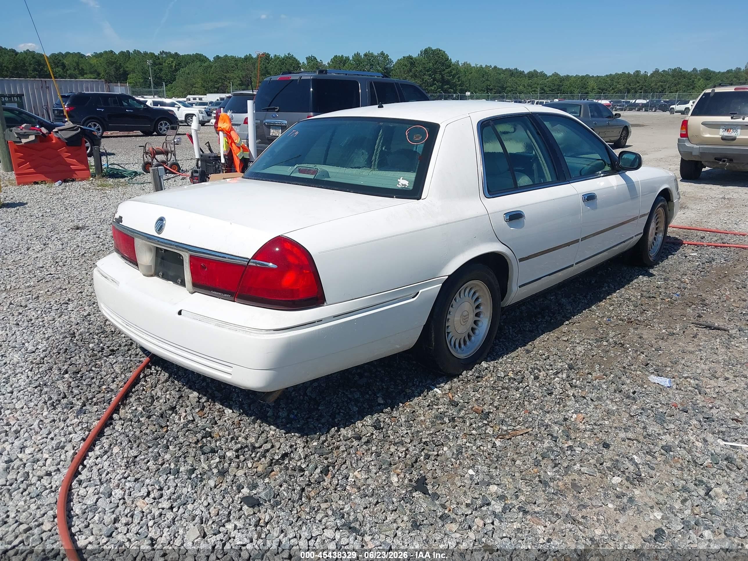 1998 Mercury Grand Marquis   White vin: 2MEFM75W3WX658702