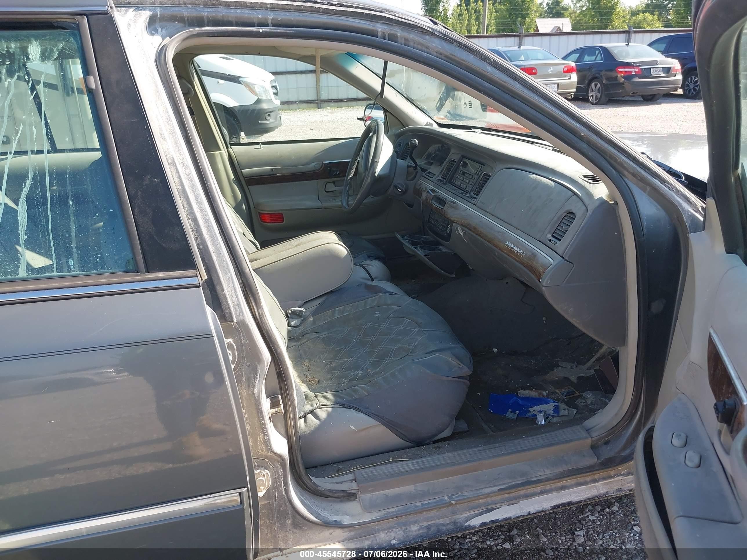 1998 Mercury Grand Marquis   Silver vin: 2MEFM75W4WX659874