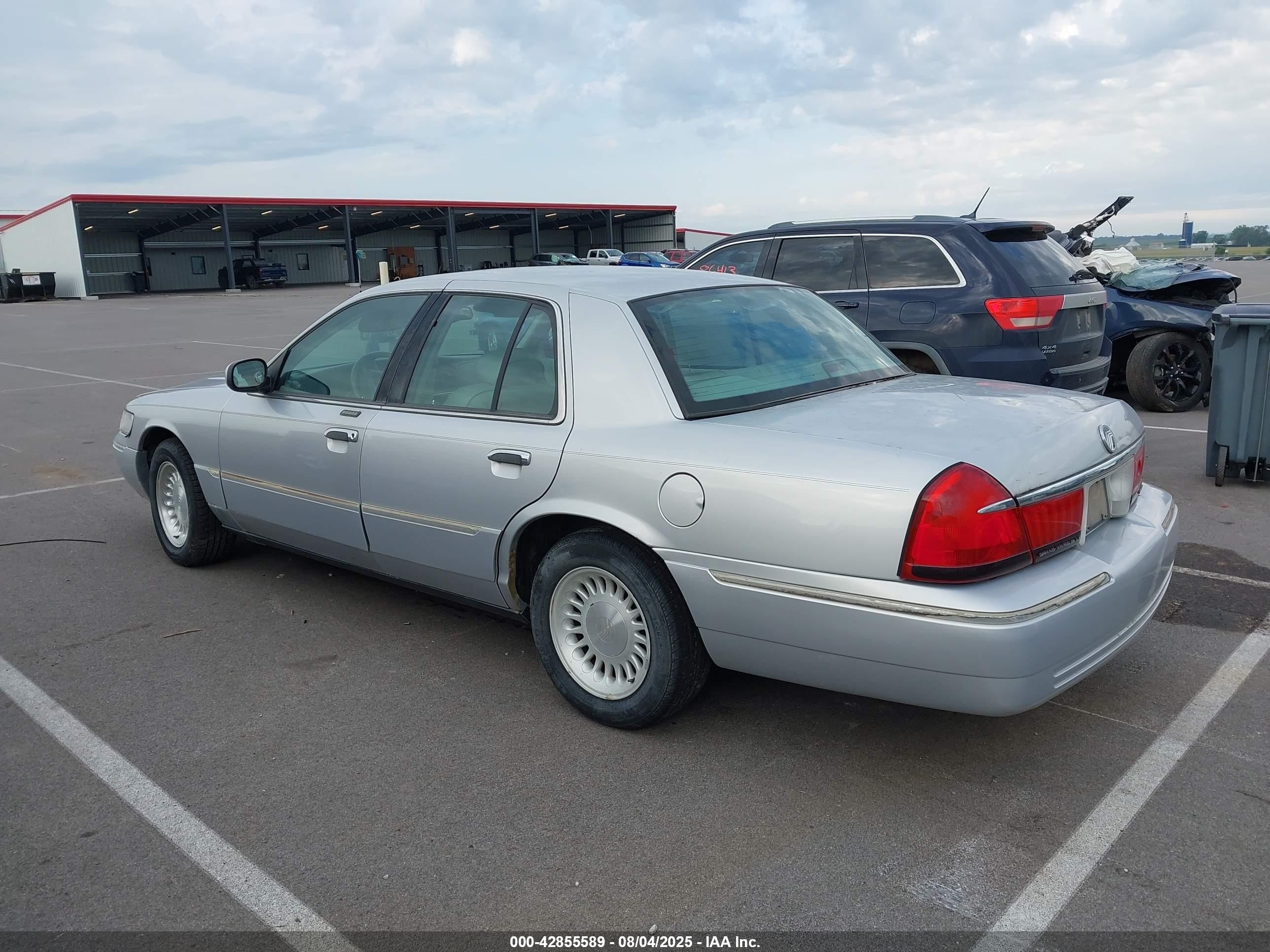 1998 Mercury Grand Marquis   Silver vin: 2MEFM75W9WX643962