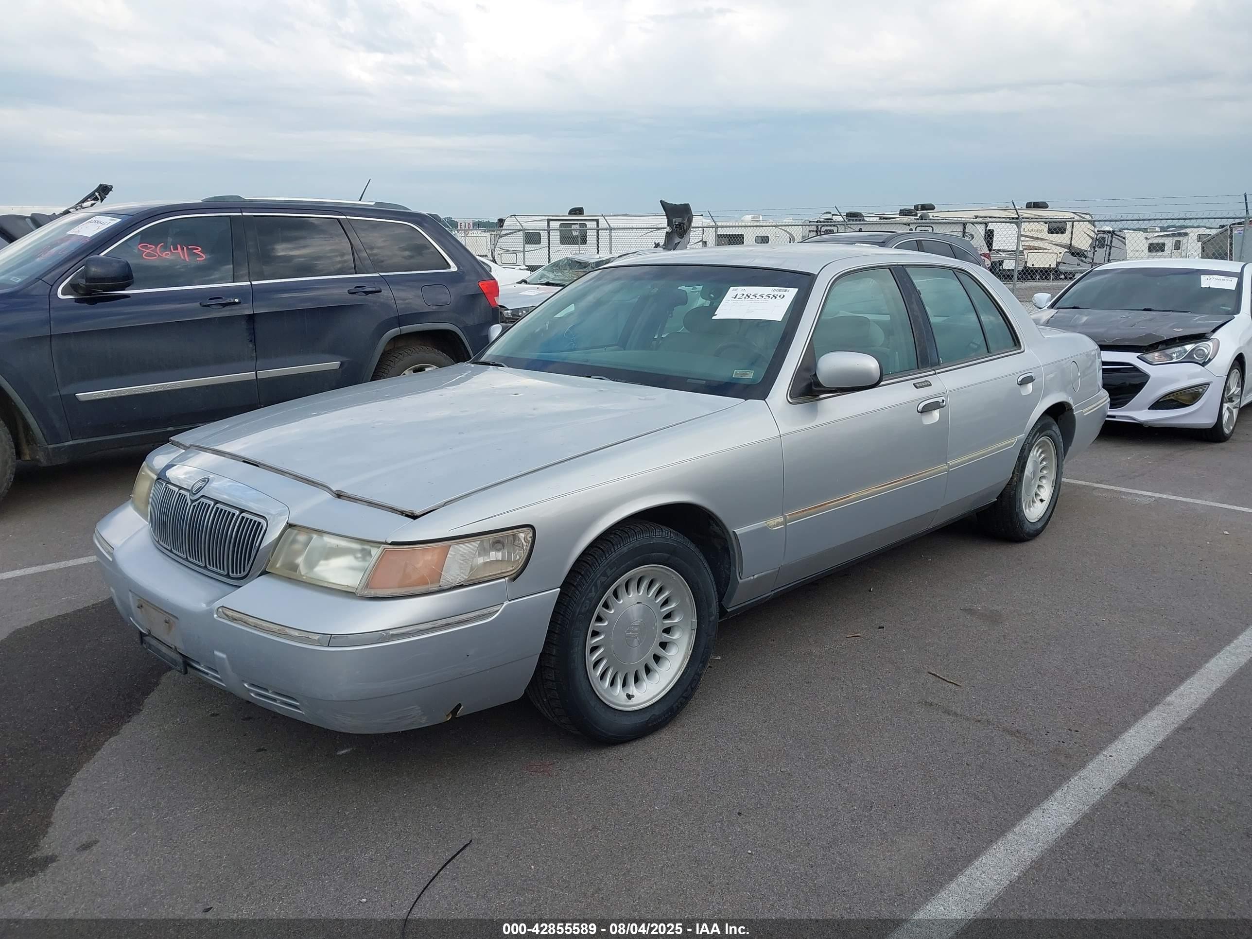 1998 Mercury Grand Marquis   Silver vin: 2MEFM75W9WX643962