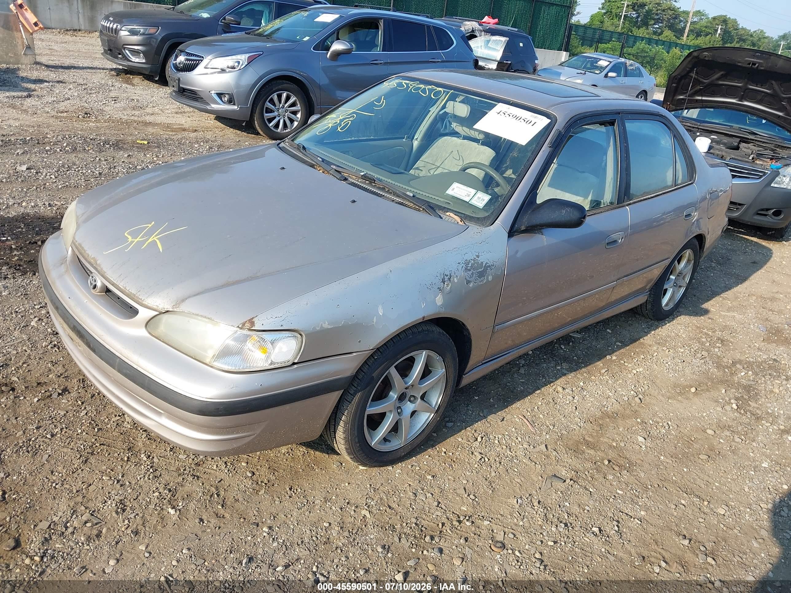 1999 Toyota Corolla Le Желто-коричневый vin: 2T1BR12E0XC110401