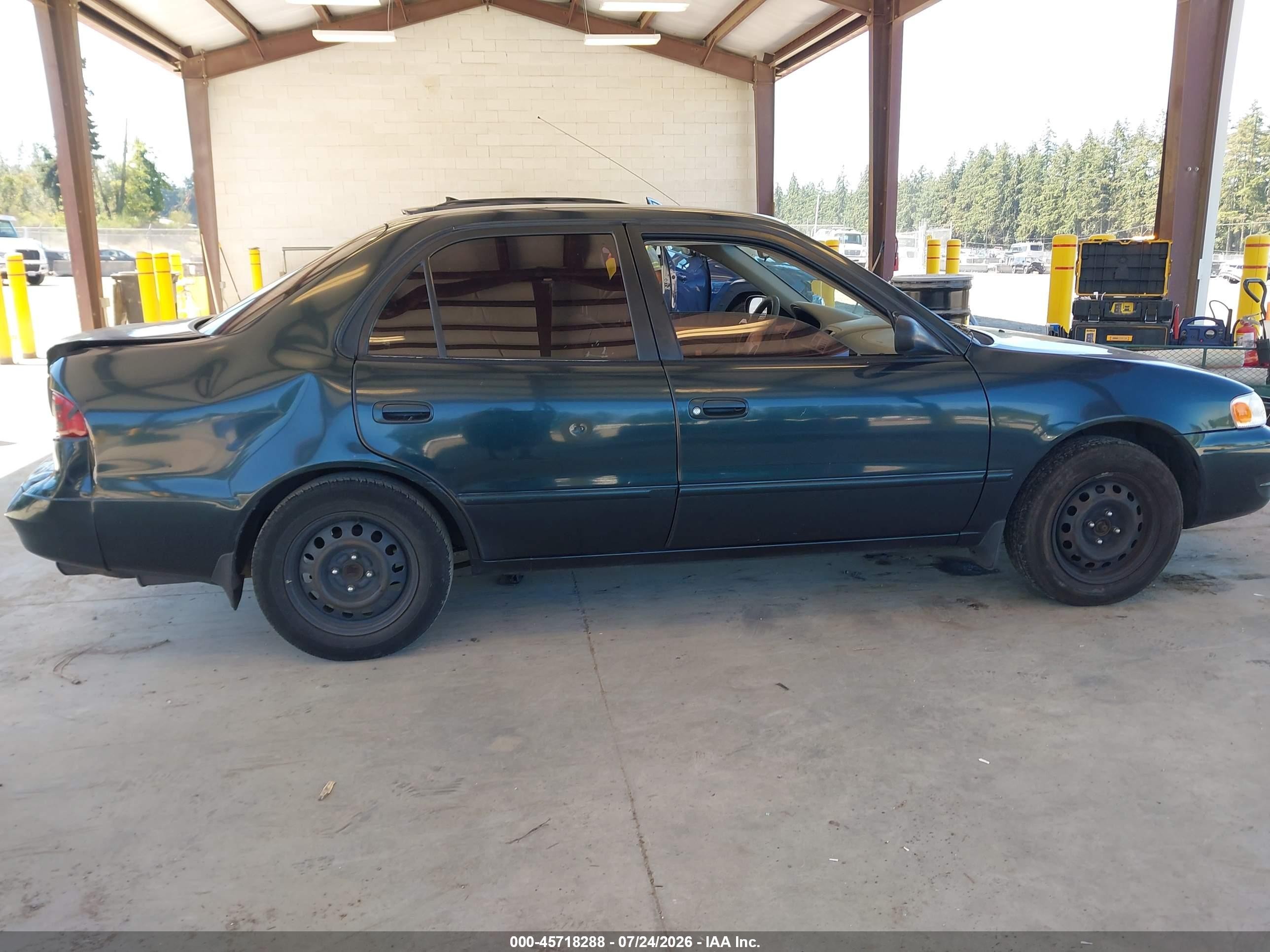 1999 Toyota Corolla Le Green vin: 2T1BR12E2XC115924