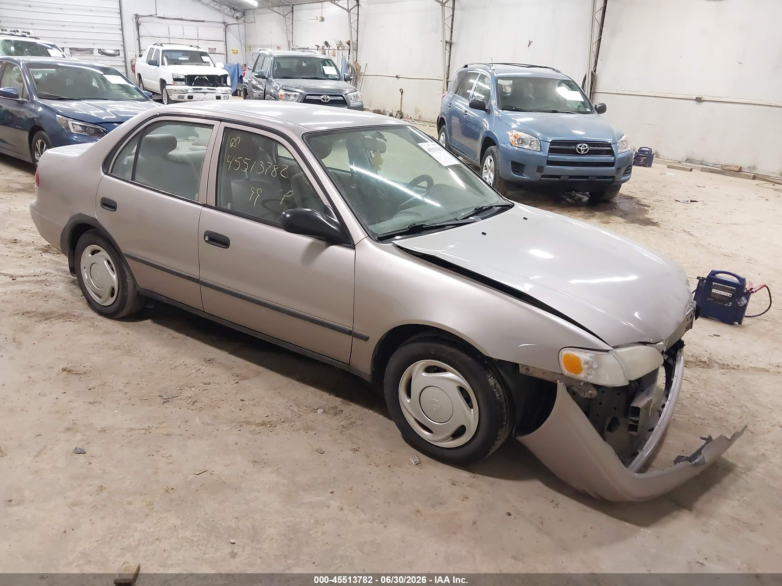 1999 Toyota Corolla Ce Tan vin: 2T1BR12E3XC116371
