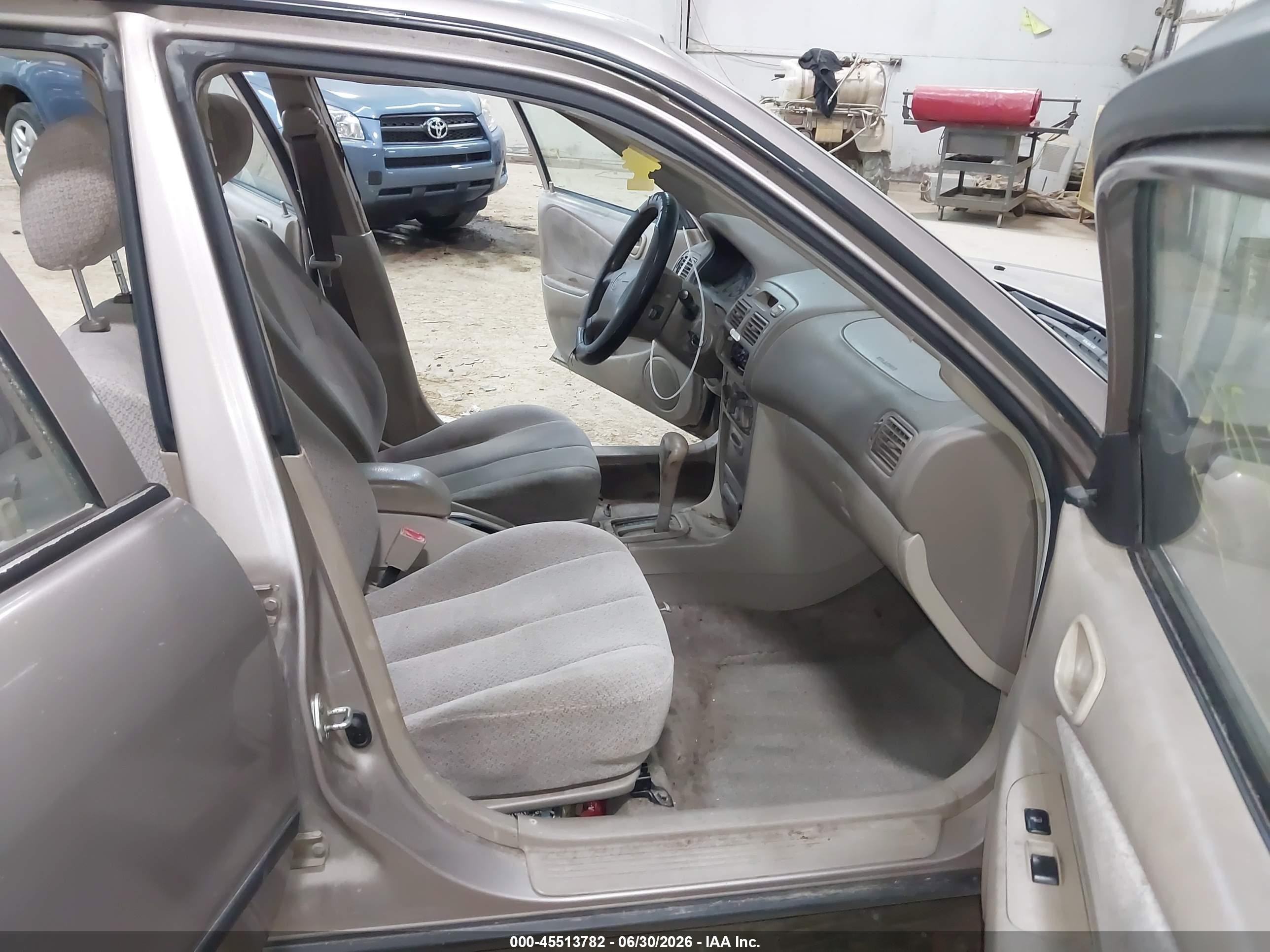 1999 Toyota Corolla Ce Tan vin: 2T1BR12E3XC116371