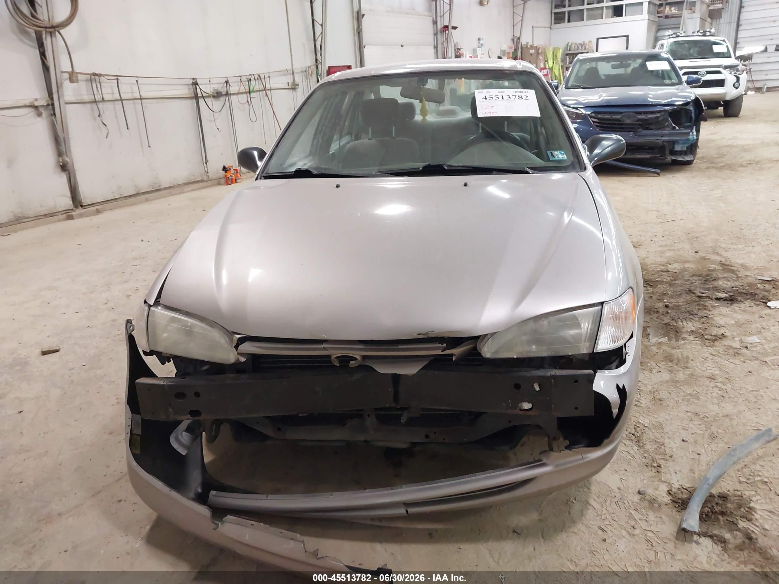 1999 Toyota Corolla Ce Tan vin: 2T1BR12E3XC116371