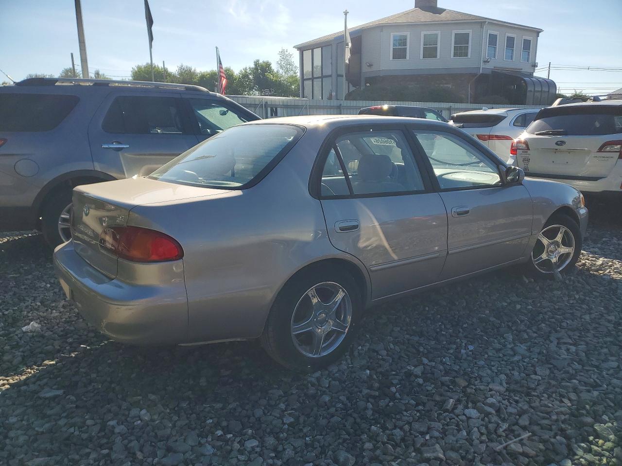 2002 Toyota Corolla Le Gold vin: 2T1BR12E52C542247