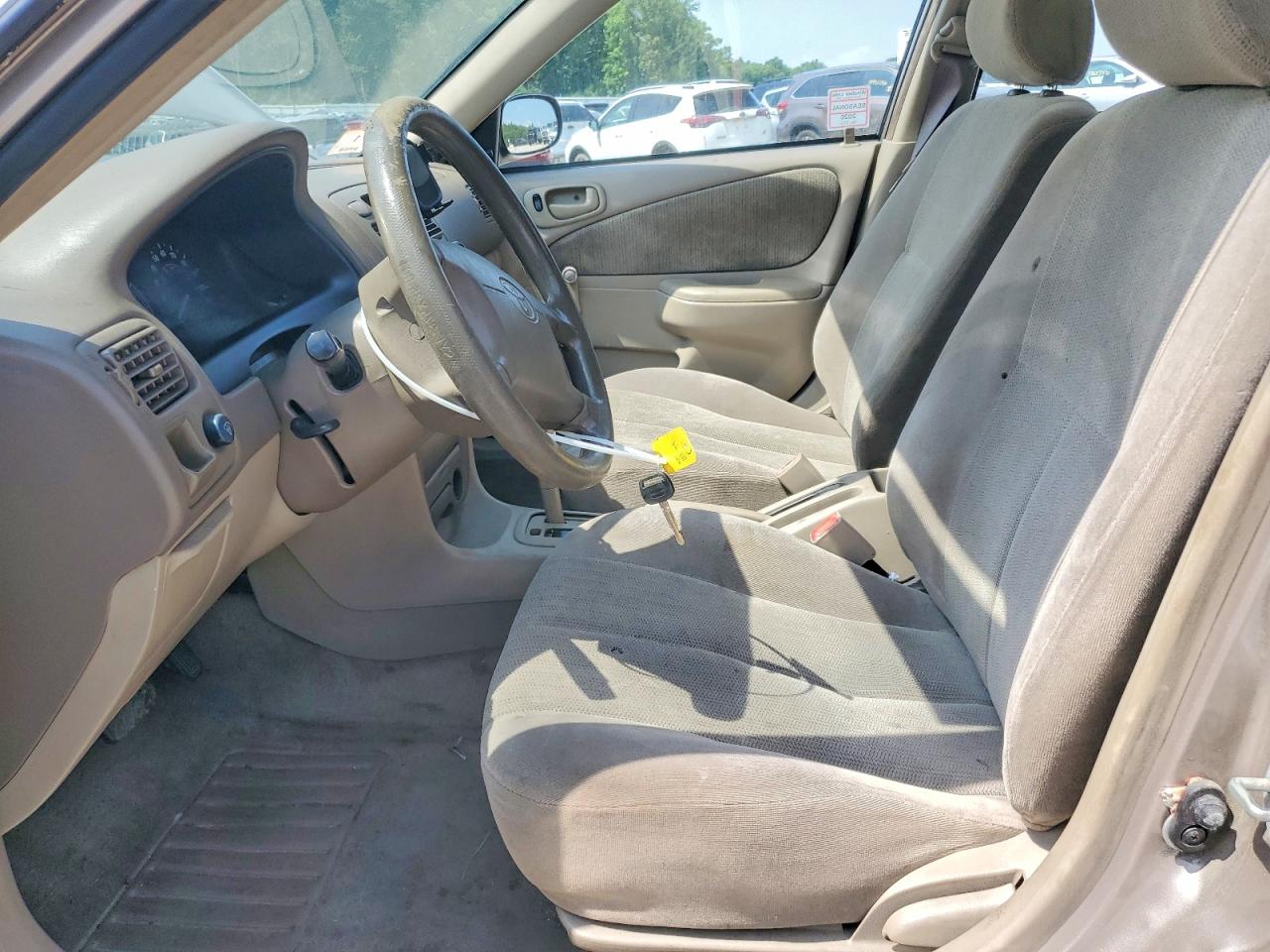 2002 Toyota Corolla Ce Желто-коричневый vin: 2T1BR12E52C865343
