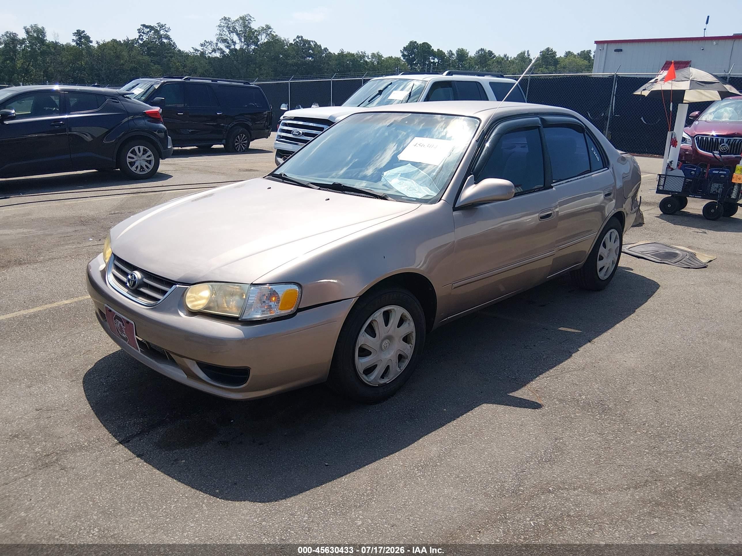 2002 Toyota Corolla Le Beige vin: 2T1BR12EX2C574305