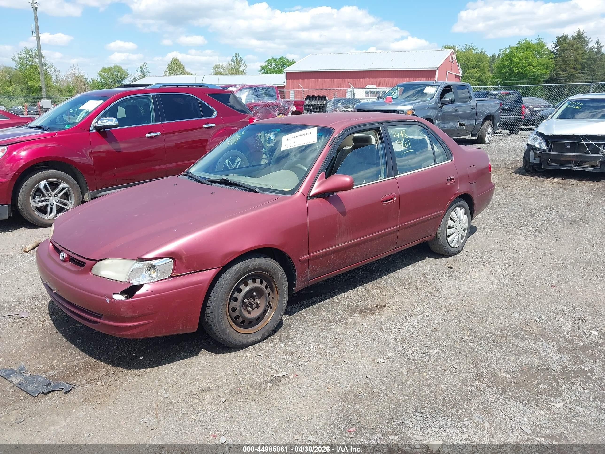 1999 Toyota Corolla Le Red vin: 2T1BR12EXXC209663