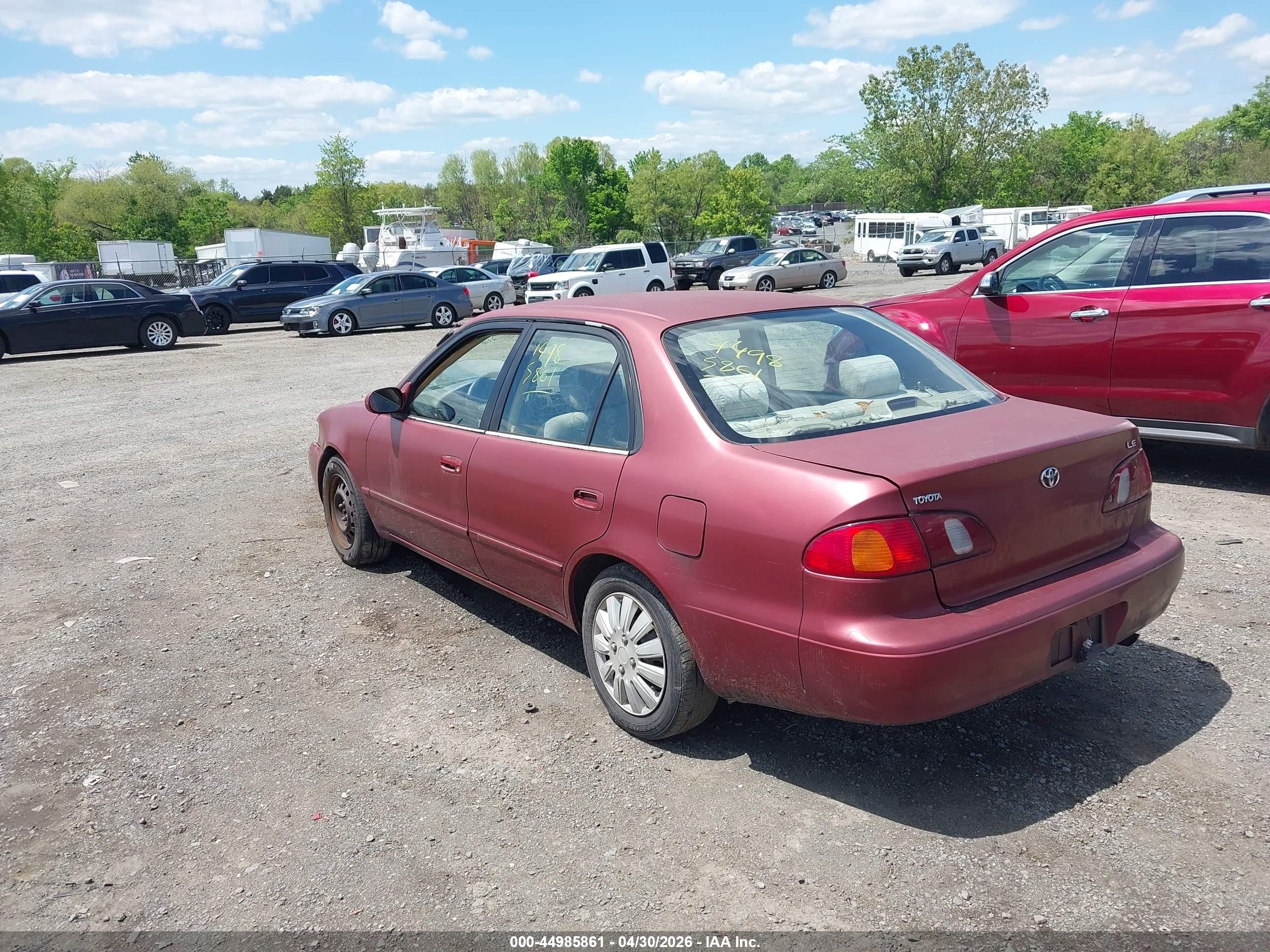 1999 Toyota Corolla Le Red vin: 2T1BR12EXXC209663