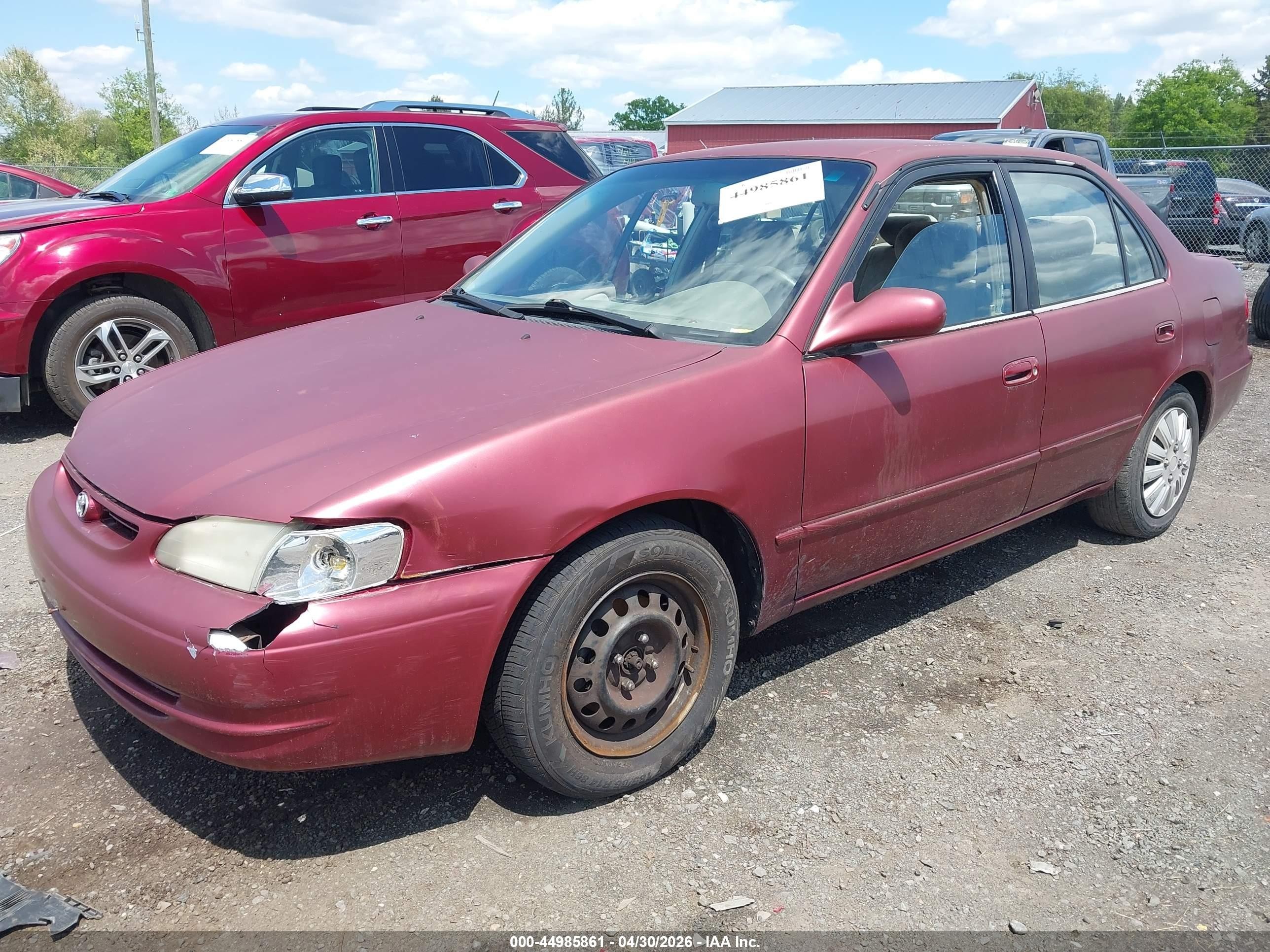 1999 Toyota Corolla Le Red vin: 2T1BR12EXXC209663