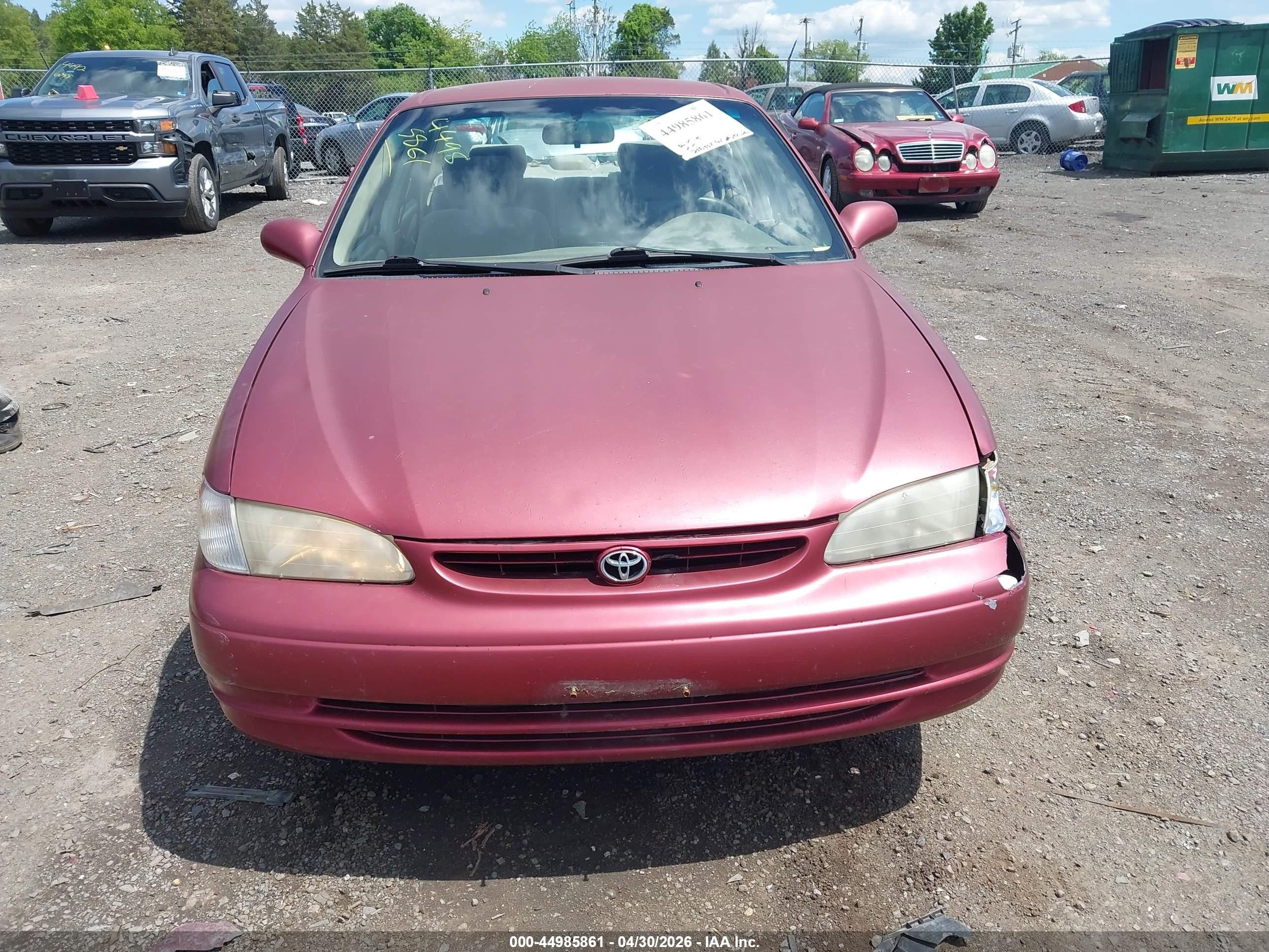 1999 Toyota Corolla Le Red vin: 2T1BR12EXXC209663