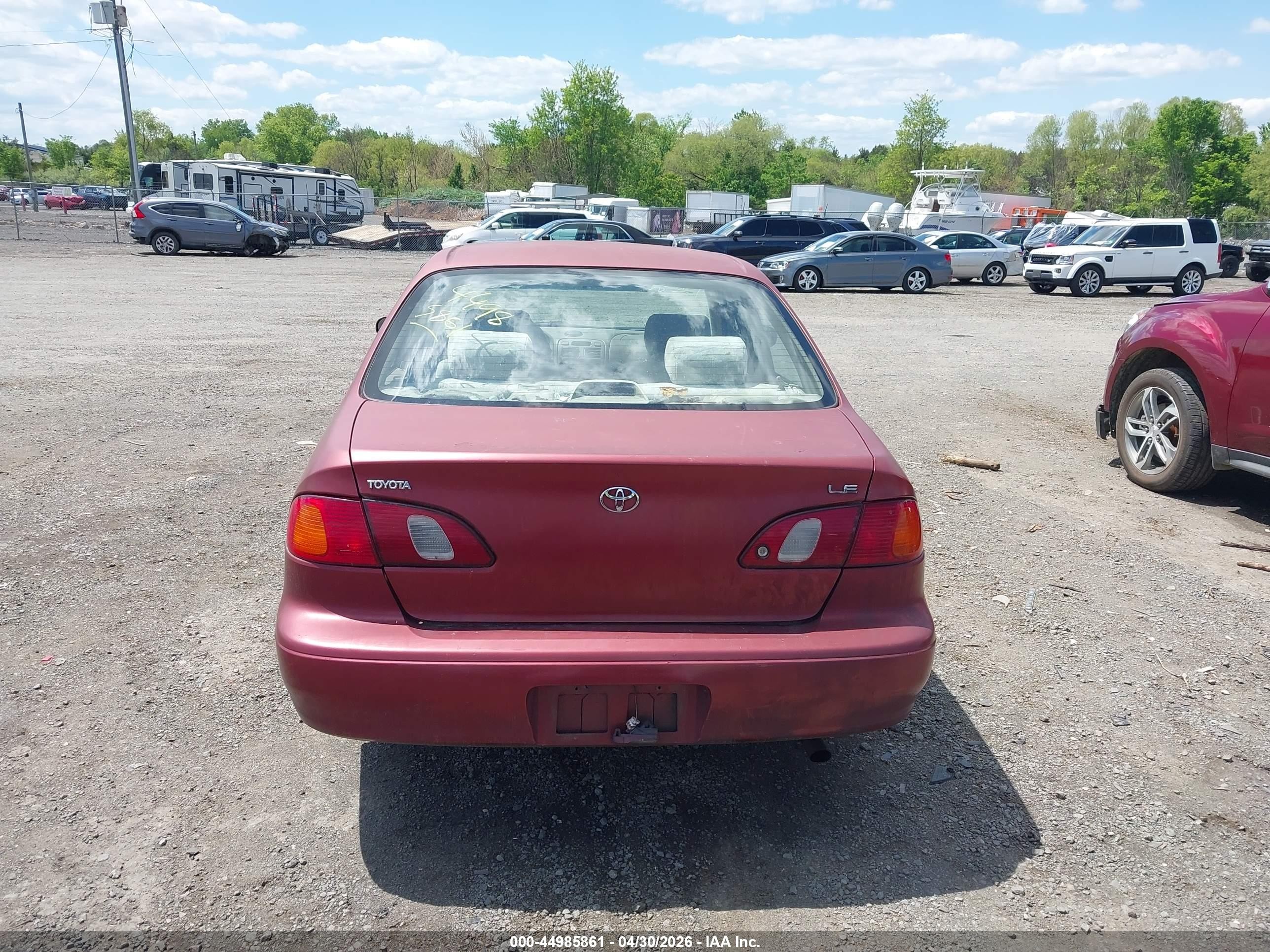 1999 Toyota Corolla Le Red vin: 2T1BR12EXXC209663