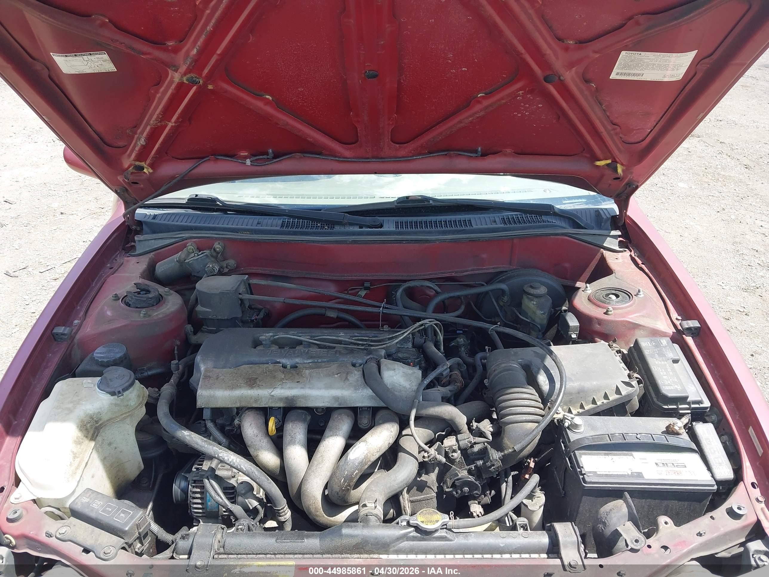 1999 Toyota Corolla Le Red vin: 2T1BR12EXXC209663