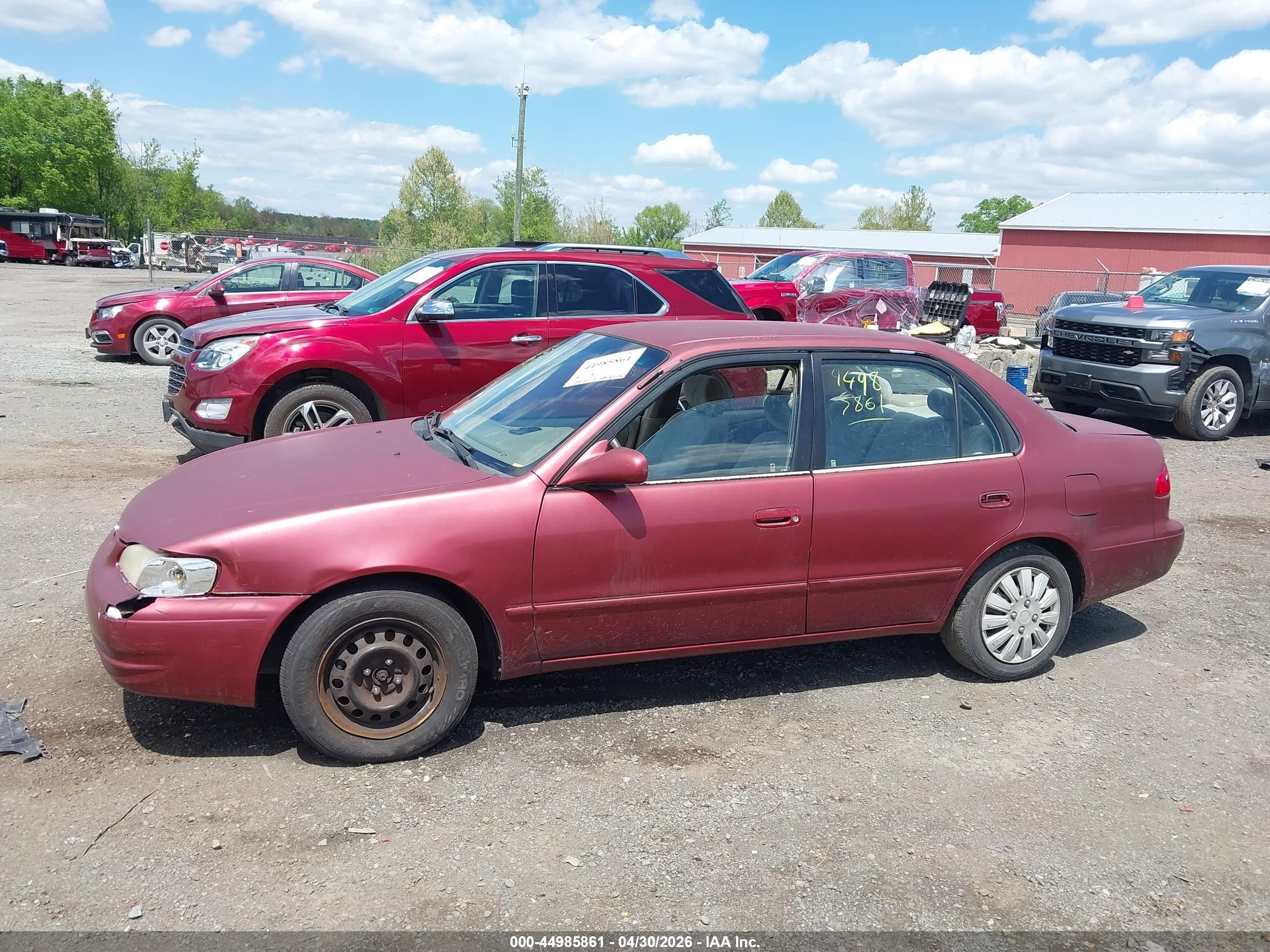 1999 Toyota Corolla Le Red vin: 2T1BR12EXXC209663
