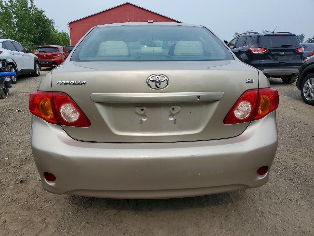2009 Toyota Corolla Base Золотой vin: 2T1BU40E79C022614